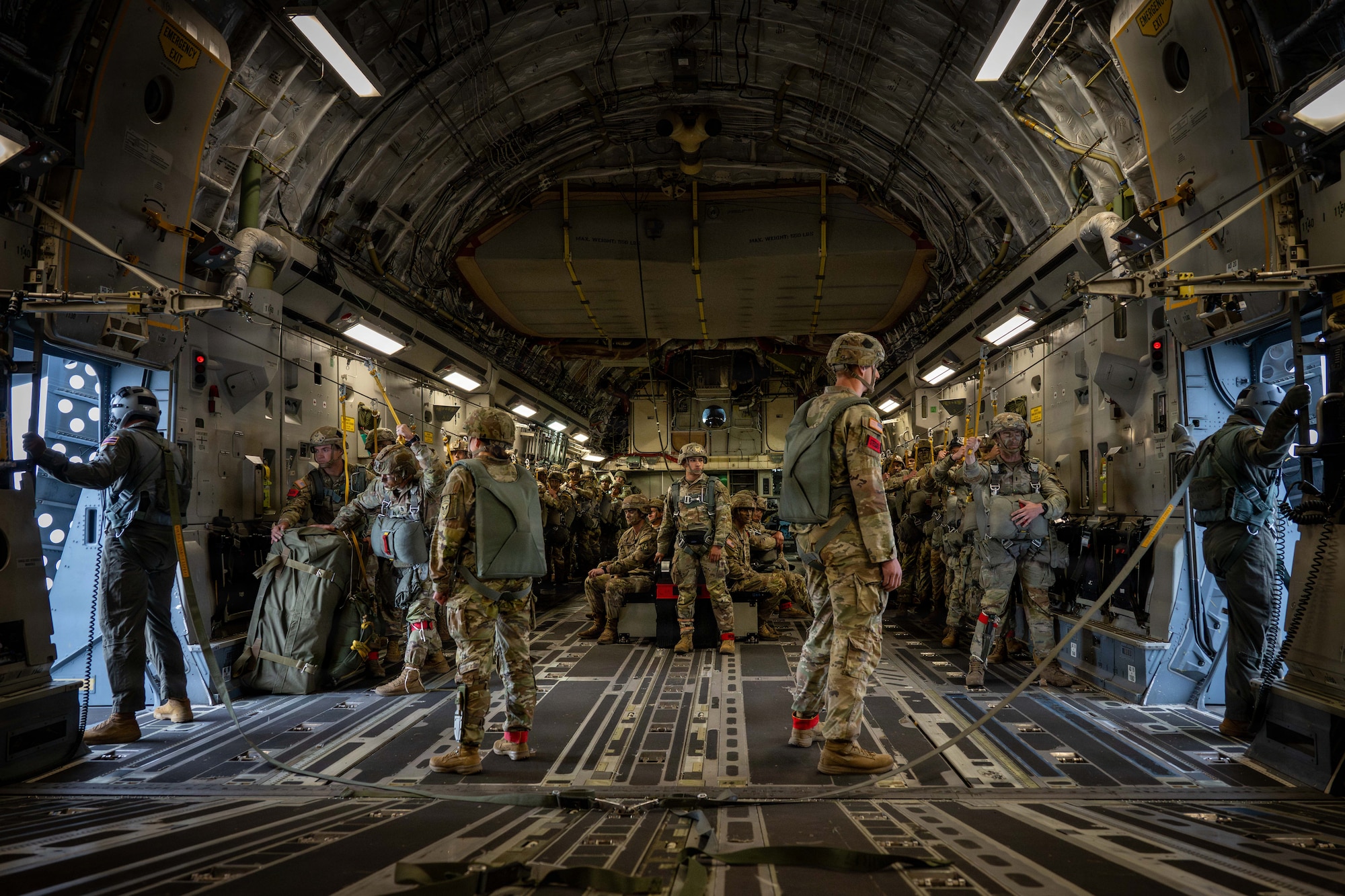 U.S. Airmen assigned to the 204th Airlift Squadron and Paratroopers assigned to the 1st
Battalion, 501st Parachute Infantry Regiment, 11th Airborne Division prepare to conduct an
airborne operation during Arctic Predictable Iron ’26 over Joint Base Elmendorf-Richardson,
Alaska, July 17, 2026. The training allowed paratroopers to refine airborne insertion procedures
while Air Force aircrews practiced the precise delivery of personnel over austere terrain. (U.S.
Air Force photo by Senior Airman Lauren Torres)