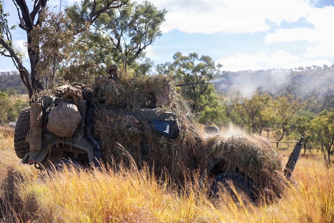 A U.S. Marine with Weapons Company, 1st Battalion, 5th Marine Regiment, Marine Rotational Force – Darwin 26, fires an M2 .50-caliber heavy machine gun during a live-fire range as part of Exercise Southern Jackaroo at Townsville Field Training Area in Queensland, Australia, July 2, 2026. Exercise Southern Jackaroo is a trilateral training event between the armed forces of Australia, Japan, and the United States that builds combined combat readiness and interoperability in the Indo-Pacific through joint operations and live-fire training. (U.S. Marine Corps photo by Sgt. Kyle Chan)