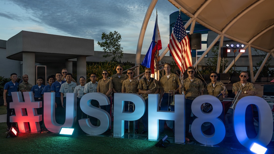 U.S. Marines with the Marine Corps Forces Pacific Band and members of the Armed Forces of the Philippines General Headquarters band pose for a photo after a concert in celebration of Freedom 250 at the SM Mall of Asia, Manila, Philippines, June 28, 2026. Marine Rotational Force – Southeast Asia supported communication coverage of the U.S. Marine Corps Forces, Pacific Band performance in Manila as part of the U.S. Embassy in the Philippines' Freedom 250 campaign. The concert celebrated the enduring friendship between the United States and the Philippines while commemorating the 250th anniversary of U.S. independence, 80 years of diplomatic relations, and the 75th anniversary of the Mutual Defense Treaty.