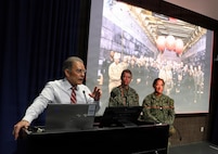 SAN DIEGO (May 14, 2026) — Mark Boman, chief of staff for Naval Medical Forces Pacific, thanks Lt. Stephanie Ryan, center, and Lt. Cmdr. Kristine Tolentino Parra, right, for sharing their experiences from the historic Artemis II recovery operations, giving the NMFP team an exclusive look at the role of Navy Expeditionary Medicine. Parra, a general surgeon and platform lead for Expeditionary Resuscitative Surgical System 14 at Navy Medicine Readiness and Training Command Camp Pendleton, and Ryan, a Navy nurse with En Route Care System 11 at NMRTC San Diego, provided medical support to the astronauts and the Navy recovery team during the operations. (U.S. Navy photo by Arsenio R. Cortez Jr.)