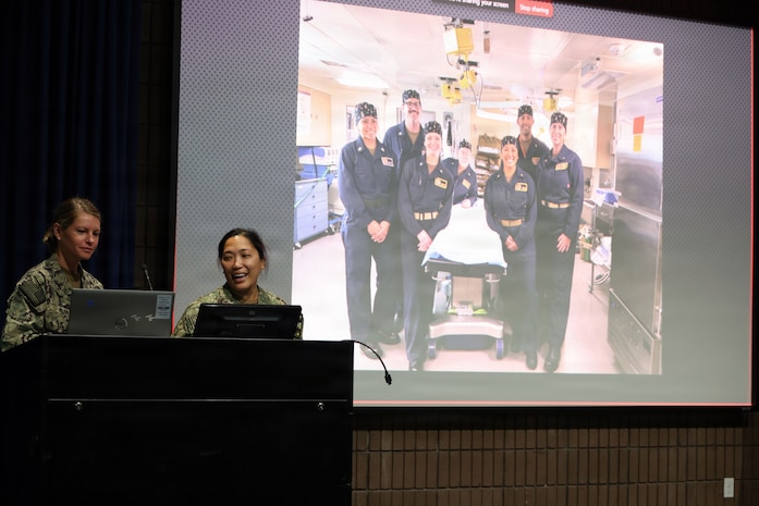 SAN DIEGO (May 14, 2026) — Lt. Cmdr. Kristine Tolentino Parra, right, and Lt. Stephanie Ryan, left, explain how the Expeditionary Medicine teams supported the historic Artemis II space recovery operations in April. Parra, a general surgeon and platform lead for Expeditionary Resuscitative Surgical System 14 at Navy Medicine Readiness and Training Command Camp Pendleton, and Ryan, a Navy nurse with En Route Care System 11 at NMRTC San Diego, shared their operational insights at the Naval Medical Forces Pacific headquarters. (U.S. Navy photo by Arsenio R. Cortez Jr.)
