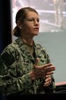 SAN DIEGO (May 14, 2026) — Lt. Stephanie Ryan, a Navy nurse with En Route Care System 11 at NMRTC San Diego, answers a question from the audience at Naval Medical Forces Pacific headquarters. Following a presentation on the Artemis II recovery mission, presentation, audience members asked about broader operational impacts, critical care gear, and transport times required to move injured patients from the recovery ship to higher-level care facilities ashore. (U.S. Navy photo by Arsenio R. Cortez Jr.)