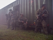 Soldiers with the Guam National Guard and the Malaysian Army prepare to move out of cover during a force-on-force exercise during Keris Strike 26 near Kota Belud, Malaysia, July 22, 2026.