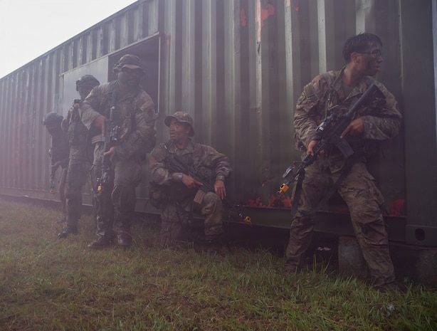 Soldiers with the Guam National Guard and the Malaysian Army prepare to move out of cover during a force-on-force exercise during Keris Strike 26 near Kota Belud, Malaysia, July 22, 2026.