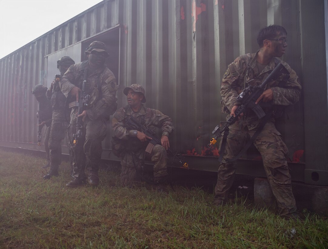 Soldiers with the Guam National Guard and the Malaysian Army prepare to move out of cover during a force-on-force exercise during Keris Strike 26 near Kota Belud, Malaysia, July 22, 2026.