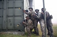 Soldiers from Guam Army National Guard and the Malaysian Army’s 5th Infantry Division take cover behind a building during a force on force exercise during Keris Strike 26 near Kota Belud, Malaysia, July 22, 2026.