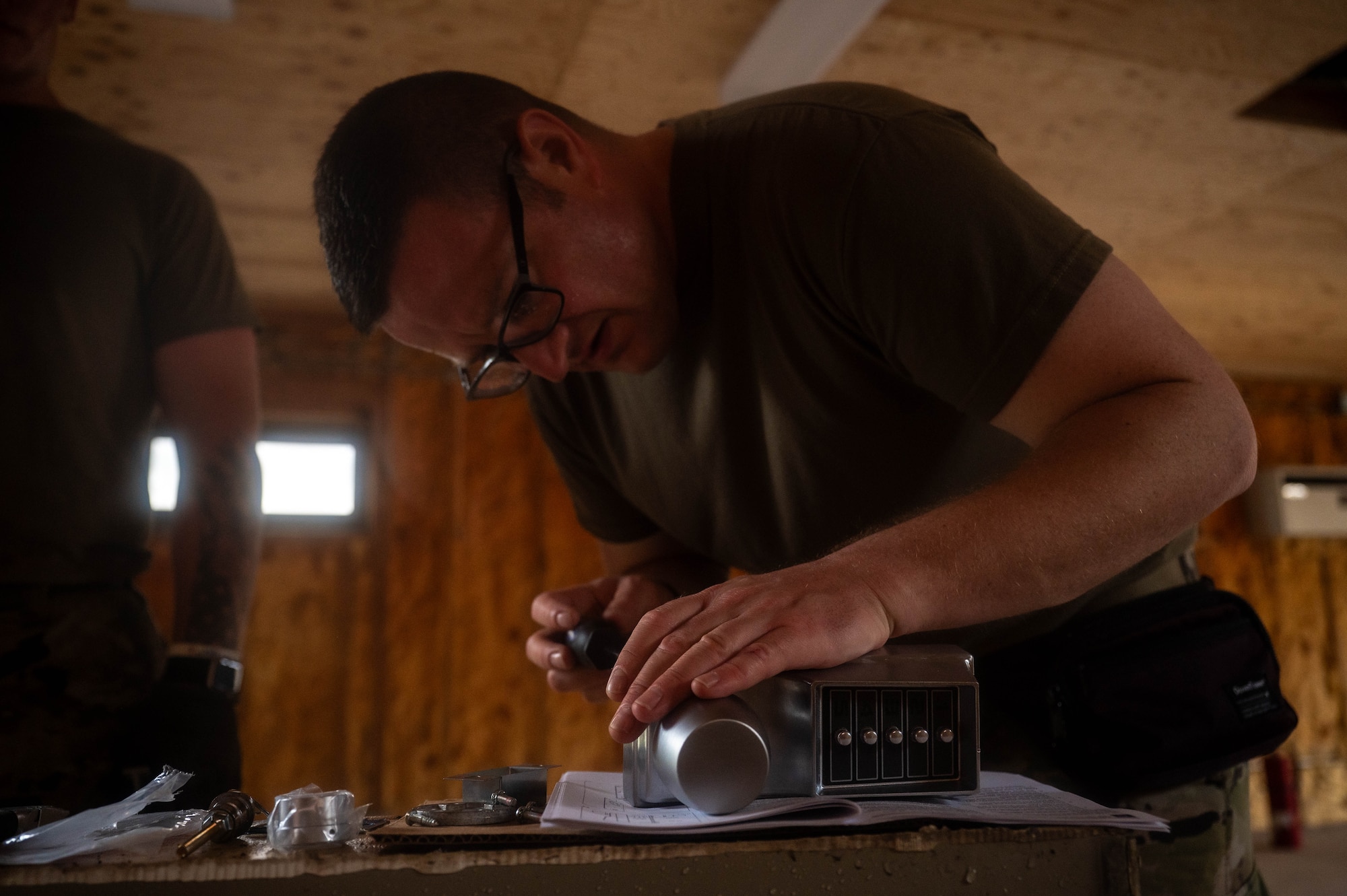 New York Air National Guard Tech. Sgt. Gary Buchanan, 107th Civil Engineer Squadron structures shop chief, assembles a lock and doorknob during a refurbishing project at Kunsan Air Base, Republic of Korea, July 8, 2026. Members of the 107th CES worked with the 8th CES to complete projects around Kunsan and ensure base facilities are maintained. (U.S. Air Force photo by Staff Sgt. Cedrique Oldaker)