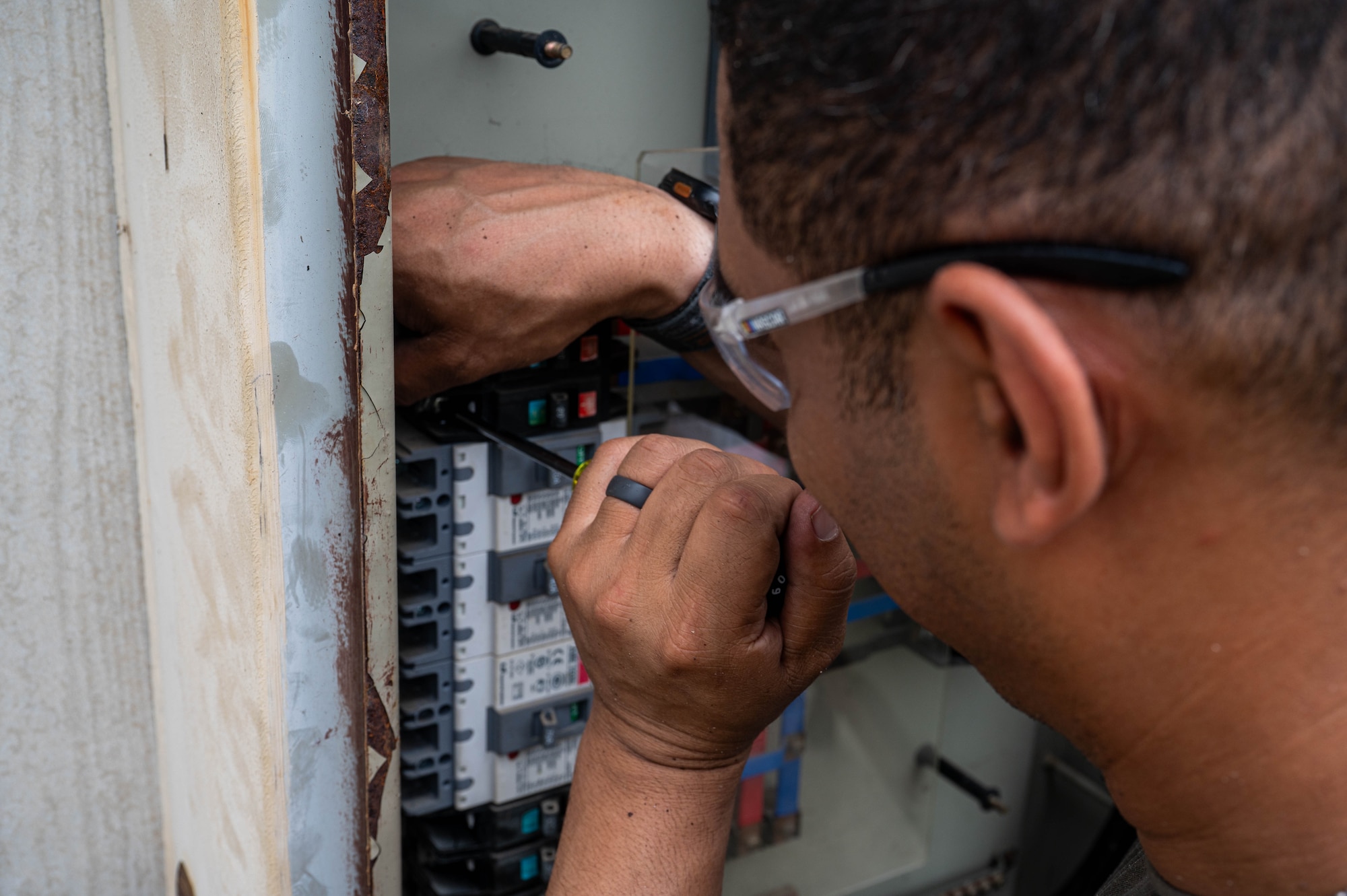 New York Air National Guard Master Sgt. Caleb Moore, 107th Civil Engineer Squadron electrical noncommissioned officer in charge, runs wires to an electrical box during a refurbishing project at Kunsan Air Base, Republic of Korea, July 8, 2026. Air National Guard and Air Force Reserve Airmen built and refined their tactical engineering skills while augmenting with 8th CES. (U.S. Air Force photo by Staff Sgt. Cedrique Oldaker)