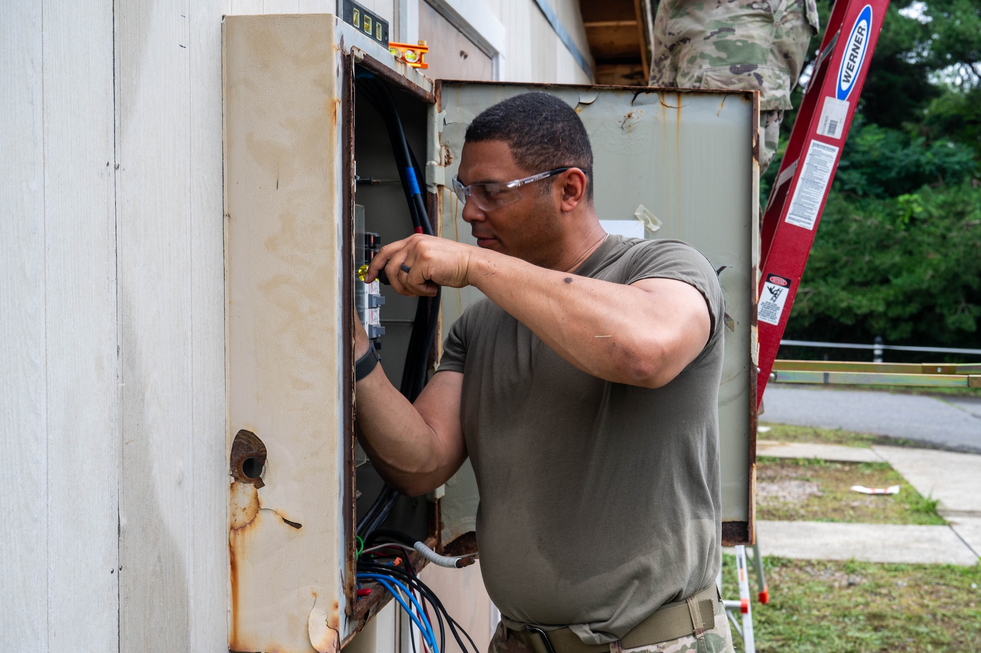New York Air National Guard Master Sgt. Caleb Moore, 107th Civil Engineer Squadron electrical noncommissioned officer in charge, runs wires to an electrical box during a refurbishing project at Kunsan Air Base, Republic of Korea, July 8, 2026. The 107th CES deployed members to Kunsan as part of a rotation of CE units visiting the base for training and to help with bigger projects being undertaken by the 8th CES. (U.S. Air Force photo by Staff Sgt. Cedrique Oldaker)
