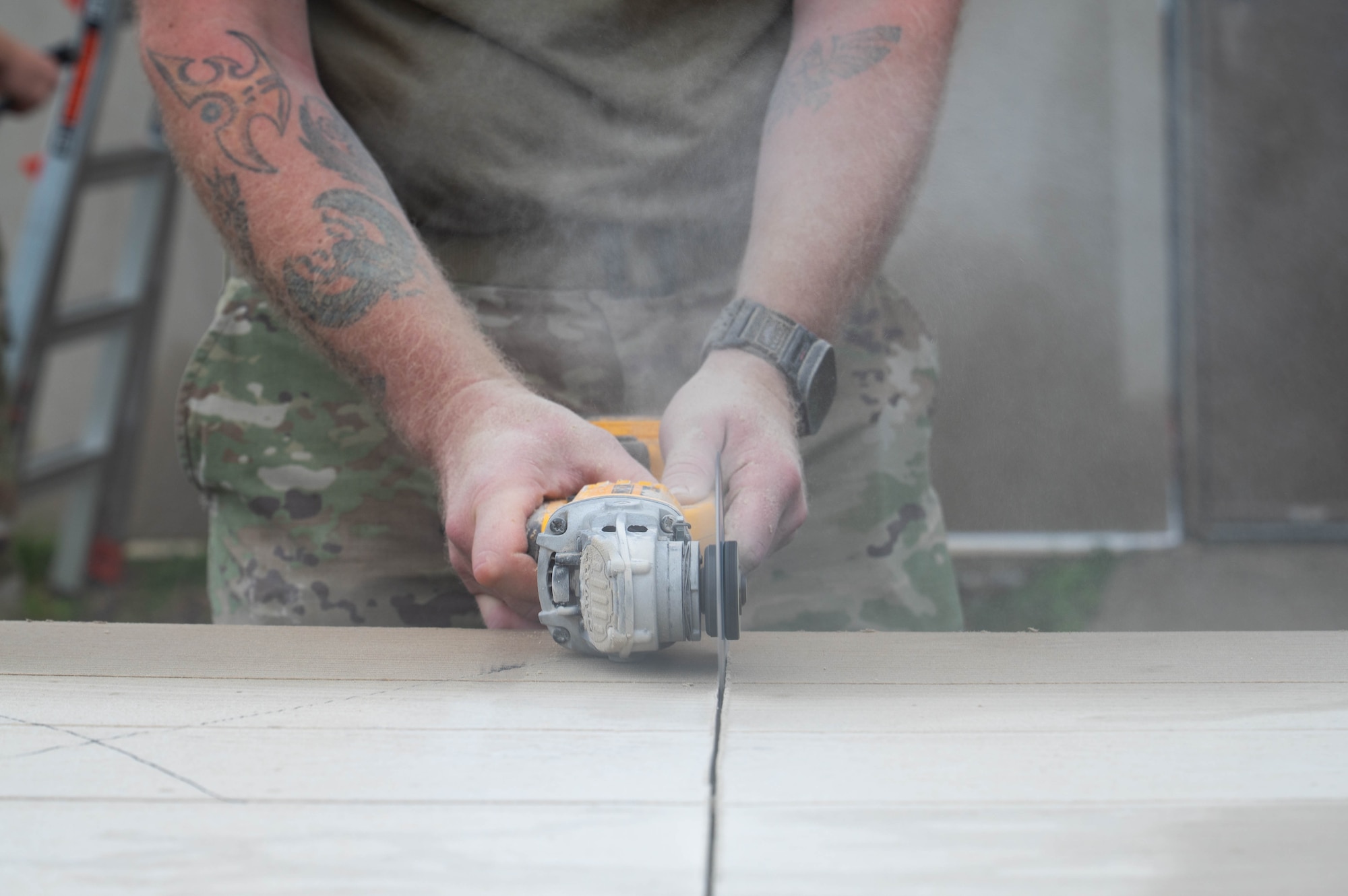 A New York Air National Guardsman assigned to the 107th Civil Engineer Squadron, Niagara Falls Air Reserve Station, New York, cuts drywall for building refurbishments at Kunsan Air Base, Republic of Korea, July 8, 2026.​ CE units from Air National Guard and Air Force Reserve deployed to Kunsan to augment with the 8th CES for hands-on training and to assist in constructing contingency bed-down facilities to support follow-on forces in training and contingency scenarios. (U.S. Air Force photo by Staff Sgt. Cedrique Oldaker)