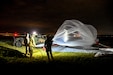 Multi-Domain Command - Europe Soldiers launch Micro High-Altitude Balloons (HABs) during a training event in Powidz, Poland in late July. The exercise validates procedures for launching, monitoring, controlling, and recovering high-altitude platforms while evaluating experimental payloads and operational concepts in a realistic operating environment. (US Army Photo by Sergeant First Class Rajheem A. Dixon)