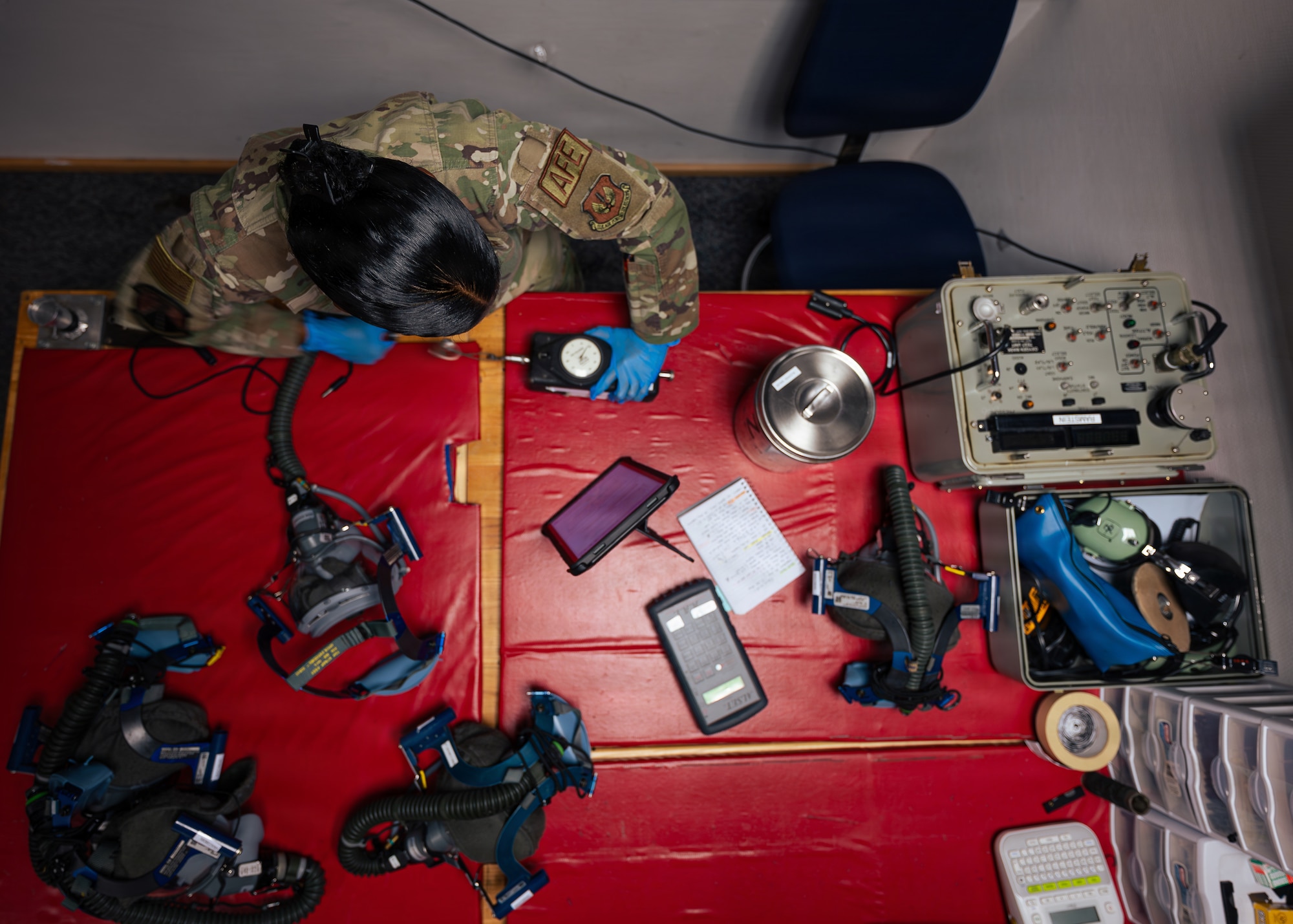 Airman inspects flight equipment