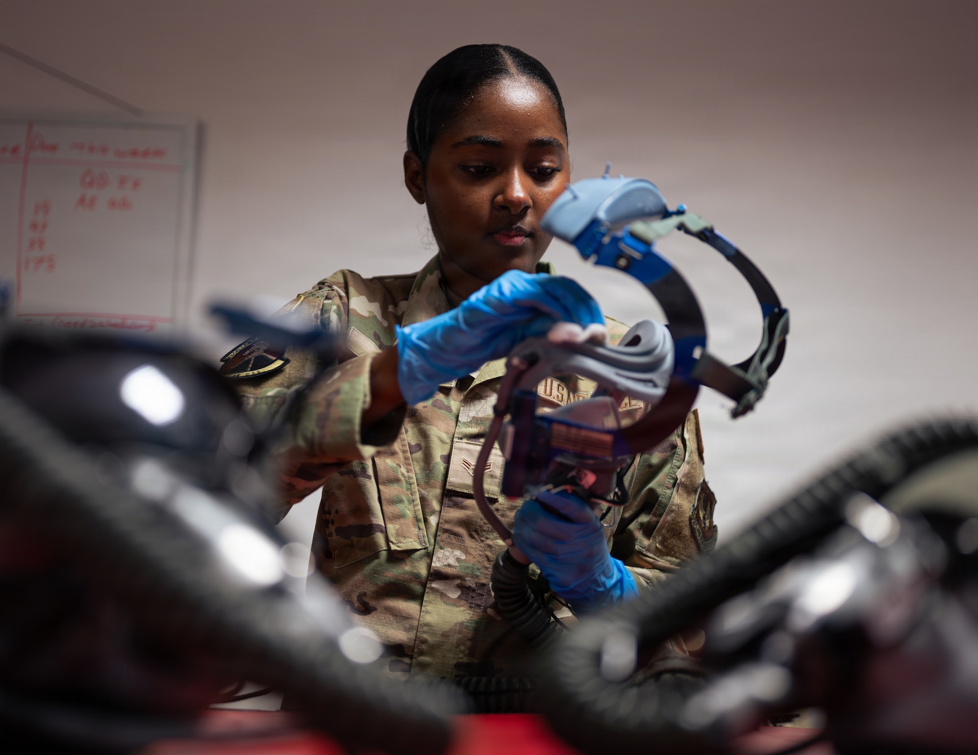 Airman cleans mask
