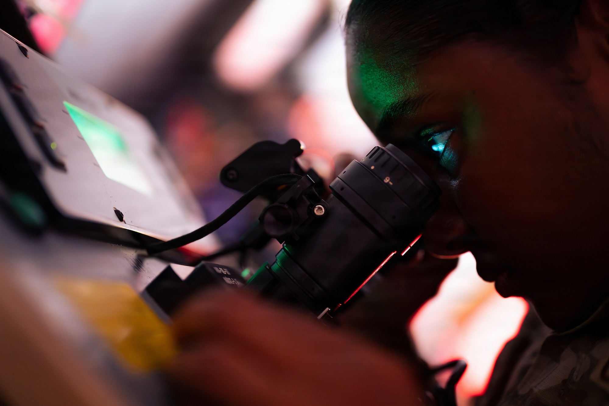 Airman calibrates night vision goggles