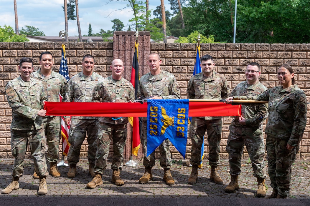 U.S. Air Force Airmen assigned to the 33d Cyberspace Operations Squadron pose for a group photo during the 33d COS Operating Location Echo opening ceremony.