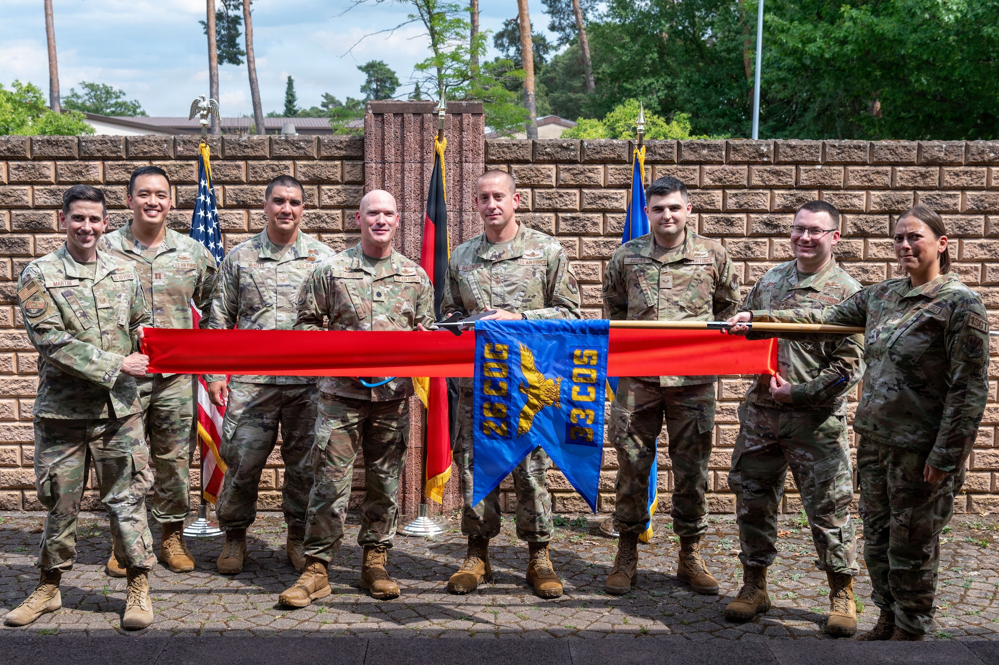 U.S. Air Force Airmen assigned to the 33d Cyberspace Operations Squadron pose for a group photo during the 33d COS Operating Location Echo opening ceremony.