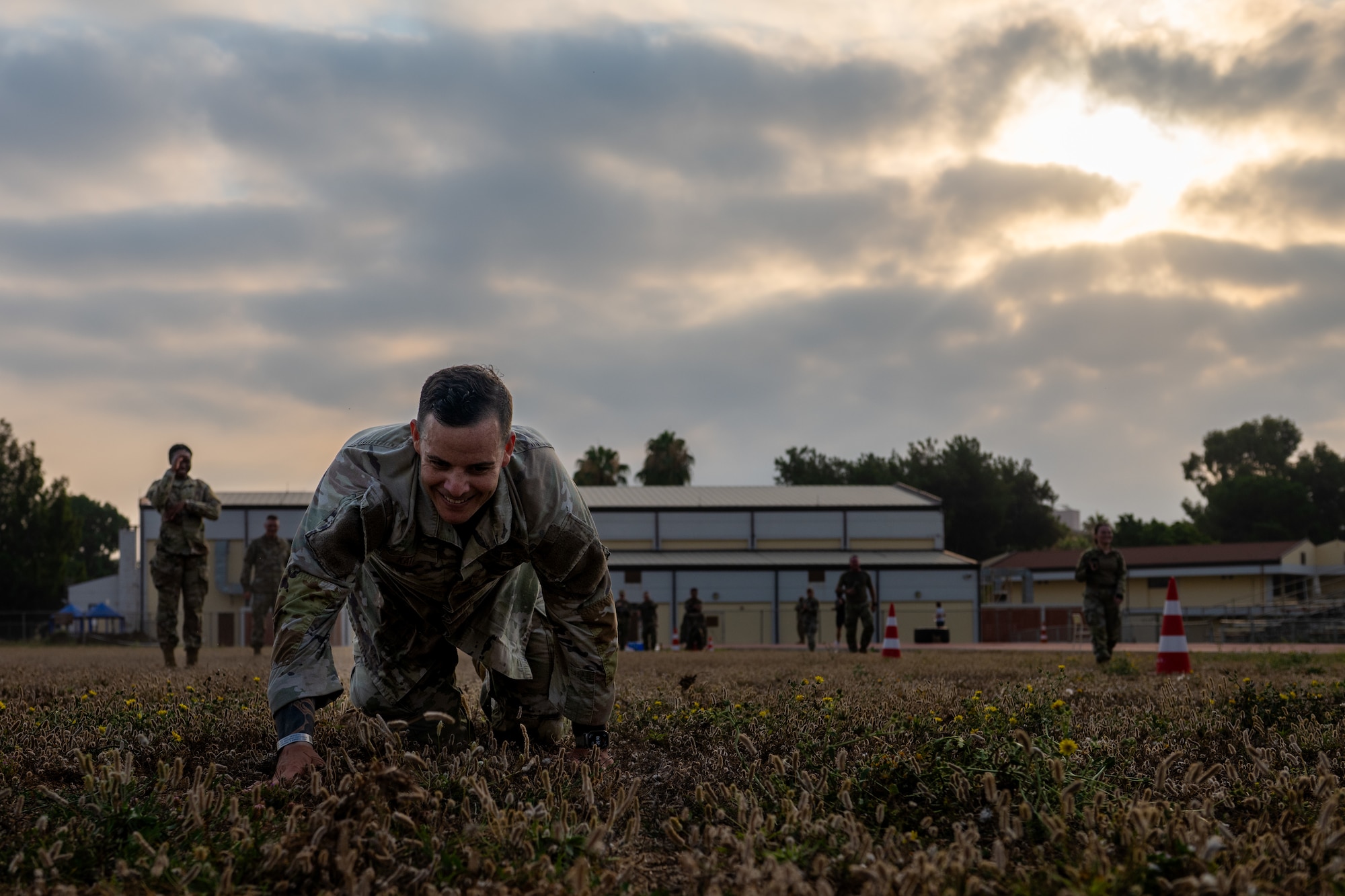 U.S. Air Force Master Sgt. Matthew Katz, 39th Air Base Wing aviation safety superintendent, low crawls through an obstacle.
