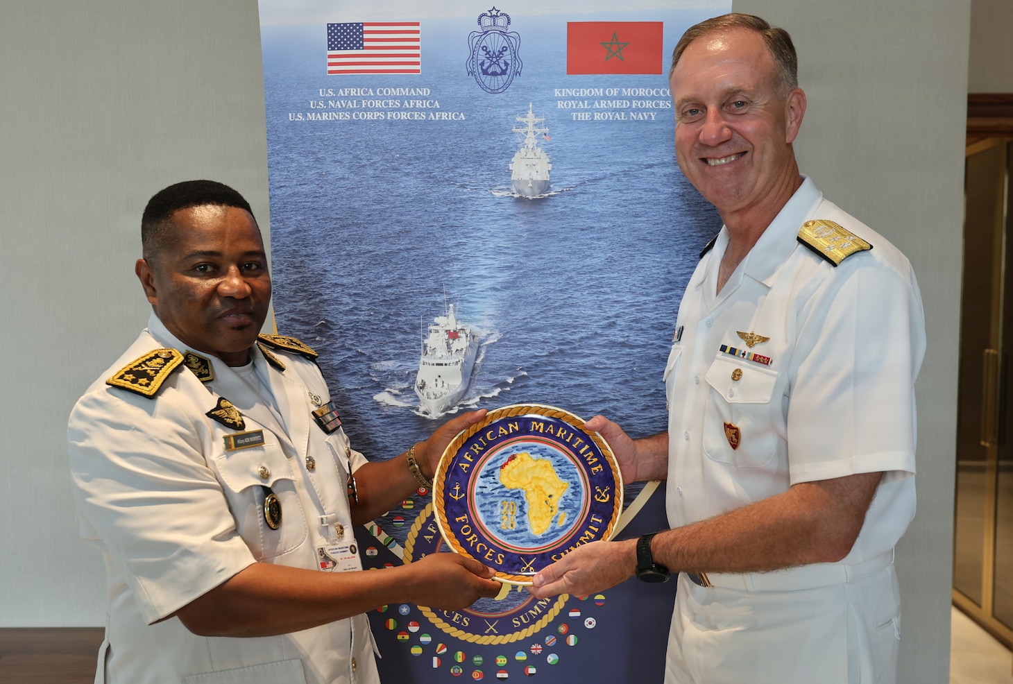 Adm. George Wikoff, Commander, U.S. Naval Forces Europe and Africa exchanged gifts with the Deputy Chief of Staff, Cameroon Navy Contre-Amiral Hilary Ade Nkwenti during the African Maritime Forces Summit 2026.