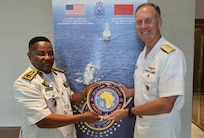 Adm. George Wikoff, Commander, U.S. Naval Forces Europe and Africa exchanged gifts with the Deputy Chief of Staff, Cameroon Navy Contre-Amiral Hilary Ade Nkwenti during the African Maritime Forces Summit 2026.