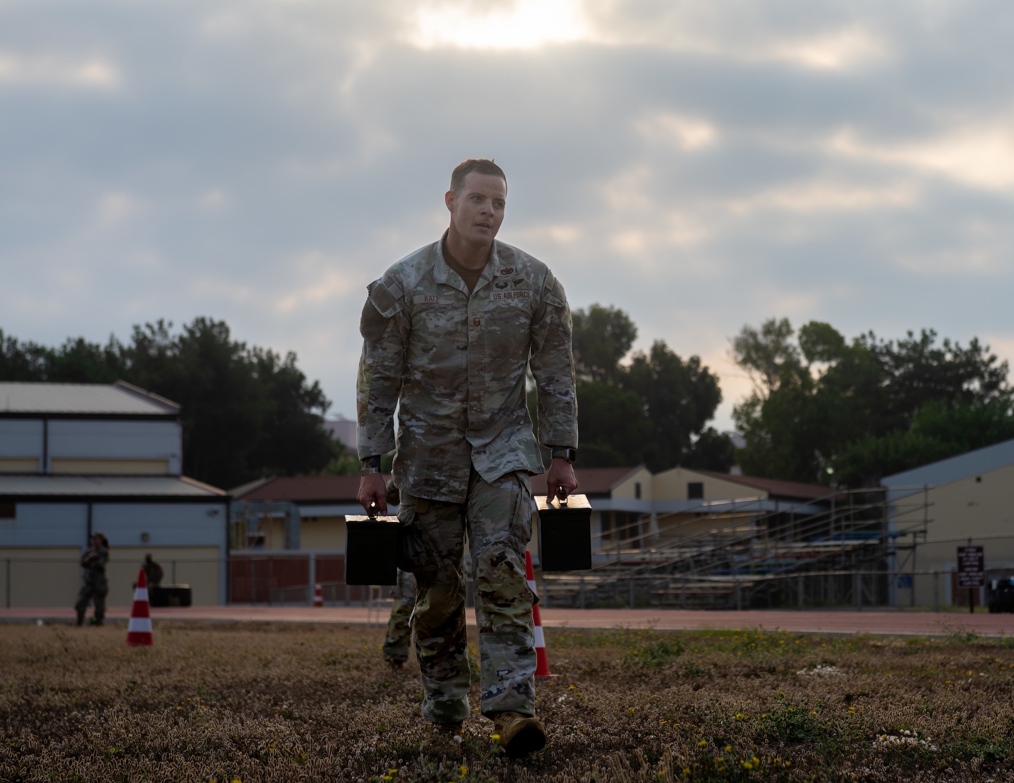 U.S. Air Force Master Sgt. Matthew Katz, 39th Air Base Wing aviation safety superintendent, carries ammunition cans.