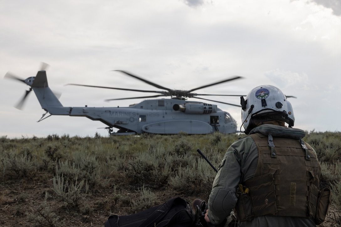 U.S. Marine Corps Maj. Tyler Frizzell, from Connecticut, a CH-53K King Stallion pilot with Marine Heavy Helicopter Squadron (HMH) 461, Marine Aircraft Group 29, 2nd Marine Aircraft Wing, prepares to board a CH-53K King Stallion during a simulated tactical recovery of aircraft and personnel near Helena, Montana, July 26, 2026. HMH-461 conducted a Marine Corps Combat Readiness Evaluation to ensure readiness for future deployments and operations. The MCCRE is a formal evaluation of an operational unit based on approved Marine Corps training and readiness tasks, conditions, and standards to ensure combat readiness. (U.S. Marine Corps photo by Lance Cpl. Perri Wood)