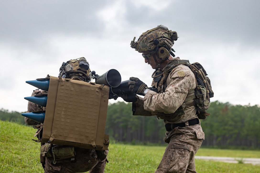 U.S. Marine Corps Sgt. Joseph Gauntlett, right, a reconnaissance Marine with 2nd Reconnaissance Battalion, 2nd Marine Division, reloads a M3A1 Multi-Role Anti-Armor Anti-Personnel Weapon System during a live-fire range on Marine Corps Base Camp Lejeune, North Carolina, July 24, 2026. This range strengthens marksmanship and combat proficiency with the MAAWS while enhancing the battalion’s readiness to execute reconnaissance and direct-action missions. (U.S. Marine Corps photo by Cpl. Judith Ann Lazaro)