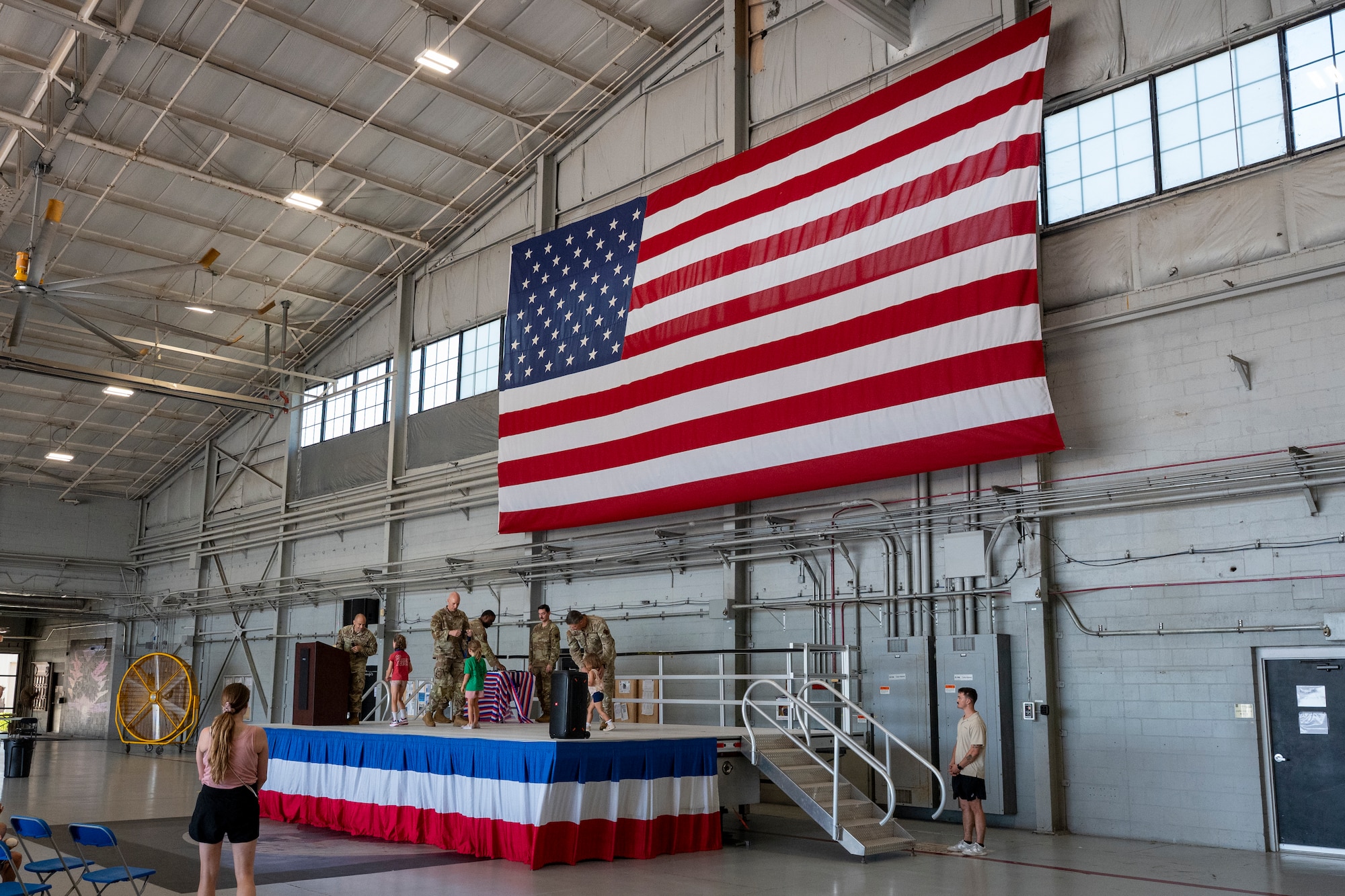 Airmen assigned to the 1st Special Operations Wing present a certificate and medal to a child during an Operation Discovering and Exploring Military Operations homecoming event at Hurlburt Field, Florida, June 27, 2026.