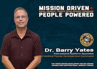 The Naval Medical Forces Development Command is Mission-Driven and most importantly People-Powered! Dr. Barry Yates, an Instructional Systems Specialist with NMFDC's Education and Training directorate, plays a central role in ensuring Navy medical personnel are trained with the most current, life-saving knowledge available. NMFDC is the headquarters element designated within the Bureau of Medicine and Surgery as a direct subordinate to the Surgeon General of the Navy, charged with leading and managing all medical training, education, professional development, and instruction to produce highly trained and ready medical personnel. Photo taken and graphic created at Joint Base San Antonio-Fort Sam Houston, July 17, 2026 (U.S. Navy graphic by Malcolm McClendon).
