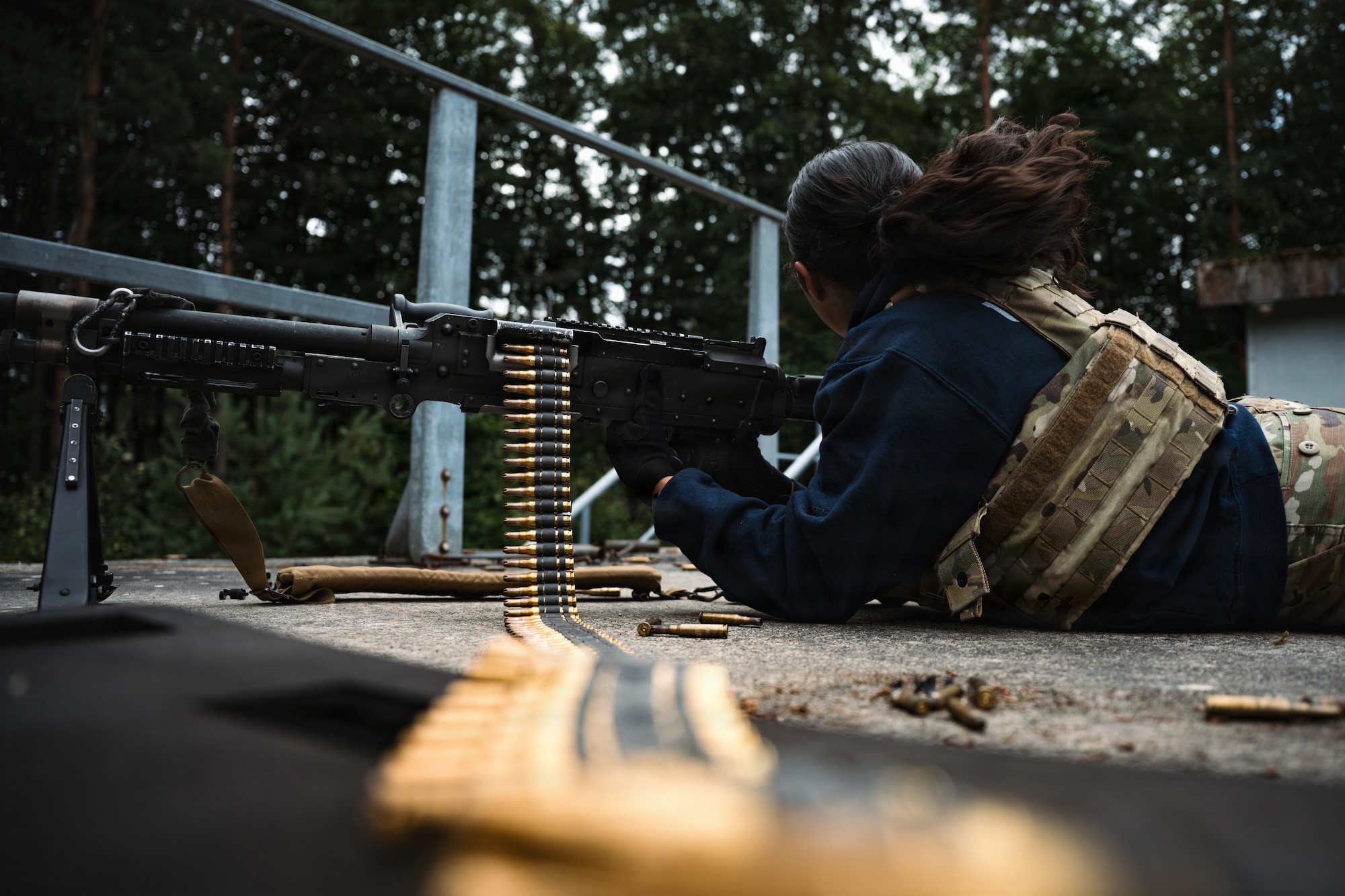 U.S. Air Force Senior Airman Ericka Bell, 569th U.S. Forces Police Squadron specialist, lays prone with an M240B machine gun during a field training exercise at Kapaun Air Station, Germany, July 23, 2026.