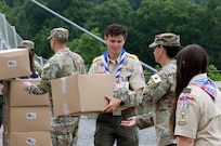West Virginia and Connecticut National Guard Soldiers help load 2,500 hygiene kits assembled at Scouting America's 2026 National Jamboree by Scouts and Jamboree volunteers as well as nearly 2,500 cleaning bucket kits to be delivered to the Weston and Buckhannon Disaster Relief centers.
