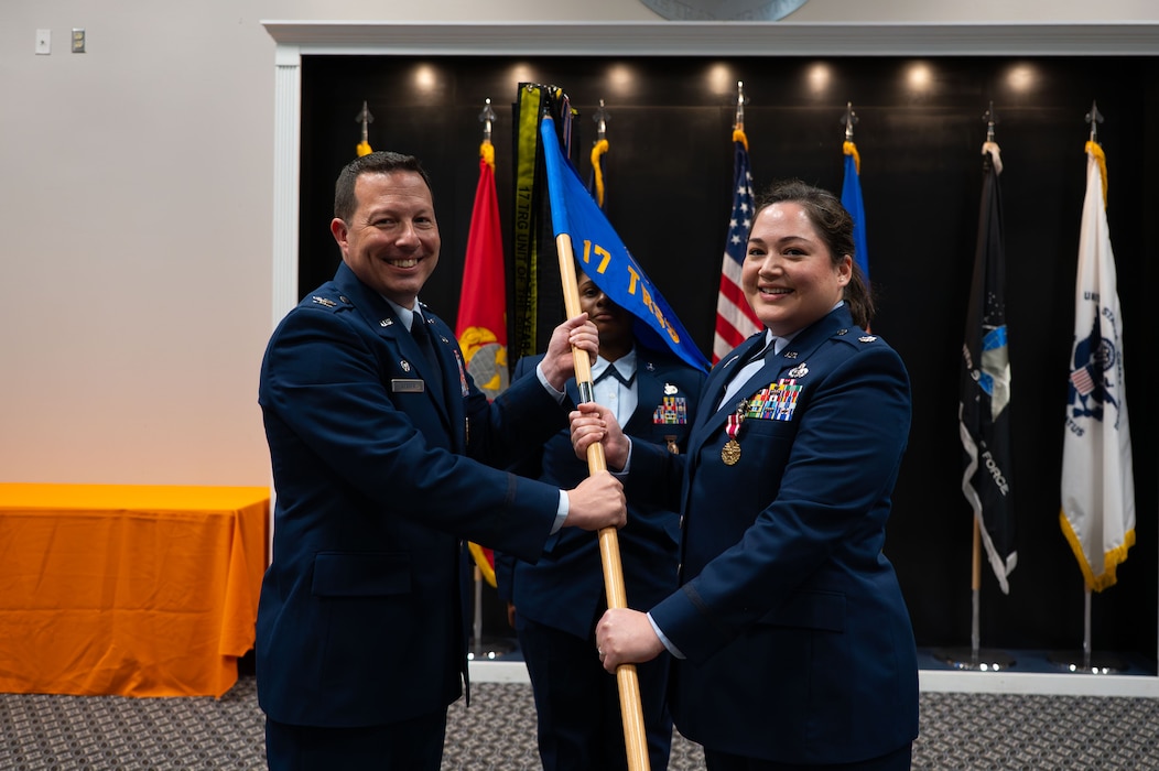 U.S Air Force Col. Jason Gerber, 17th Training Group commander, and Lt. Col. Nancy Schwab, outgoing 17th Training Squadron commander, participate in the passing of the guidon during the Change of Command Ceremony, Goodfellow Air Force Base, Texas, July 23, 2026.
