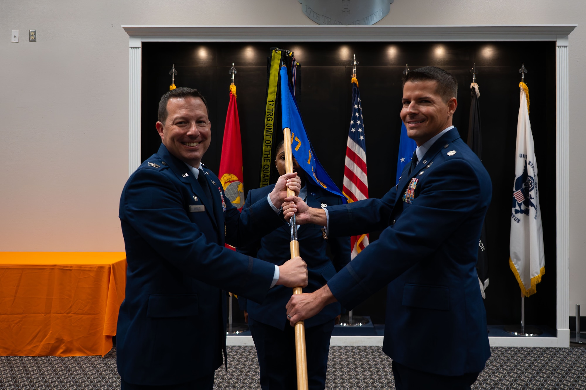 U.S Air Force Col. Jason Gerber, 17th Training Group commander, and Lt. Col. Lee Elsenheimer, incoming 17th Training Squadron commander, prepare for the passing of the guidon during the Change of Command Ceremony, Goodfellow Air Force Base, Texas, July 23, 2026.