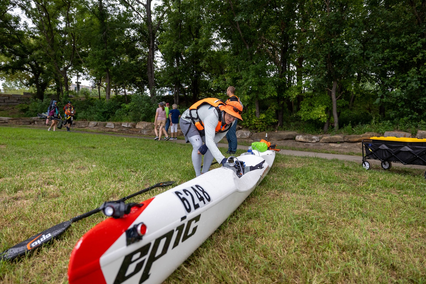 Man fixing kayak.