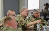 Lieutenant. Col. Peter Moldrup, Chile Liaison/Region West, Danish Home Guard, and Army Master Sgt. Jared Bulinski, Observer Controller Trainer (OC/T) , 86th Training Division, discuss training strategies July 24, 2026 at the OC/T Academy, Fort McCoy, Wis.  Moldrup attended the 84th Training Command's OC/T Academy 20-25 July as part of the Military Reserve Exchange Program. (U.S. Army Reserve photo by Sgt. 1st Class Justin Hardin)