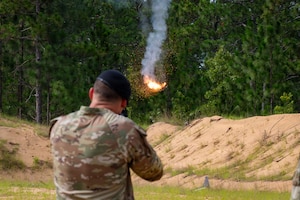 An Airman shoots down a drone