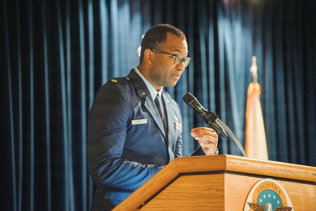 man speaking at podium