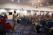 U.S. Air Force Chief Master Sgt. Anthony Thompson Jr., senior enlisted leader for Joint Base Anacostia-Bolling and 11th Wing command chief, talks to newly inducted senior noncommissioned officers during an Air Force and Space Force SNCO Summit at JBAB, Washington, D.C., July 27, 2026. The summit featured a series of briefings focused on preparing senior enlisted leaders to develop and mentor the next generation of Airmen and Guardians while emphasizing the critical importance of keeping the force informed and ready to address the challenges posed by strategic competitors. (U.S. Air Force photo by Senior Airman Geneva Nguyen)
