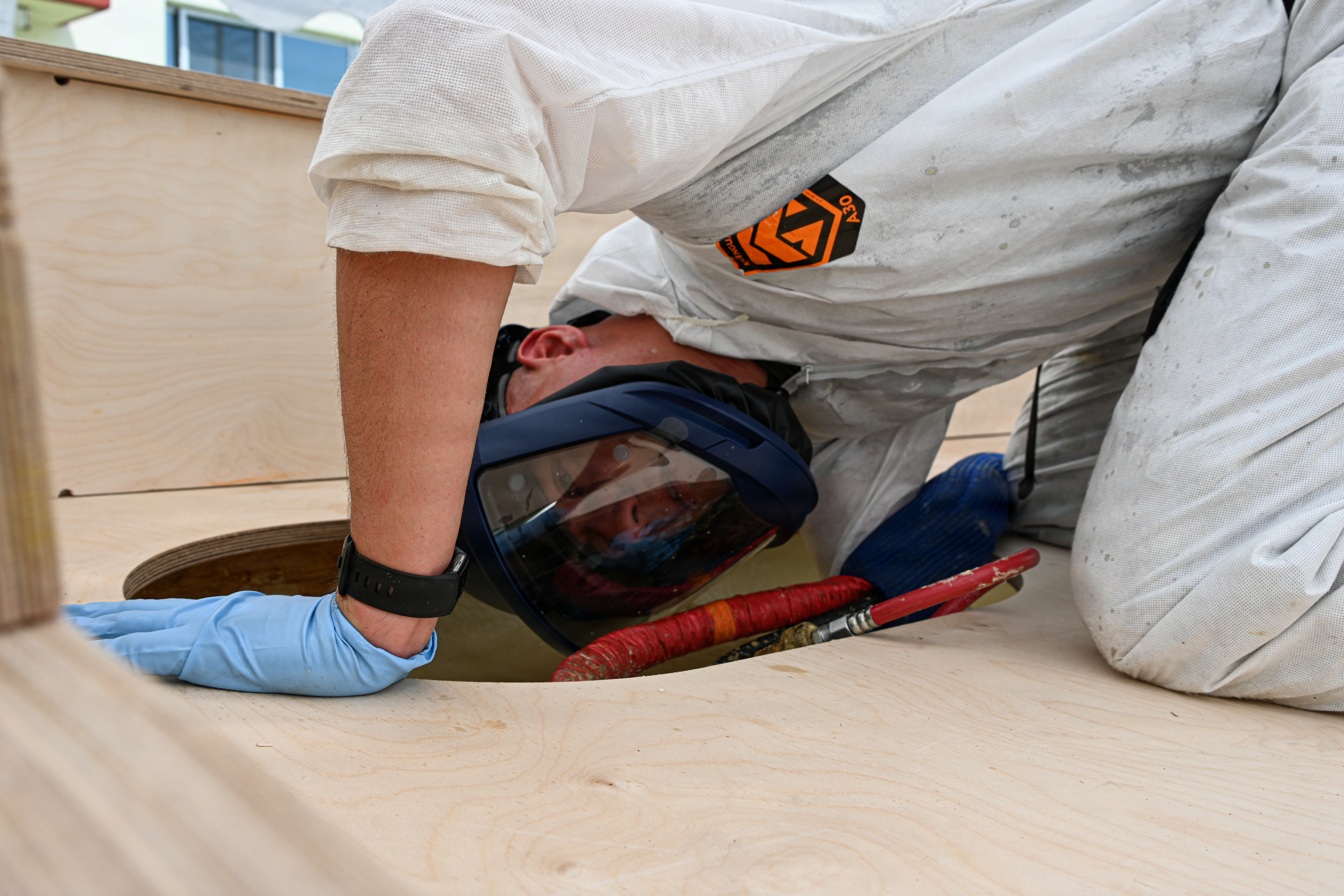U.S. Marine Corps Cpl. Noah Uhrbrock, a calibration technician with Intermediate Repair Company, 3rd Maintenance Battalion, 3rd Marine Logistics Group, sprays internal foam into a Foam Raiding Craft mold during Valiant Shield 26 on Camp Kinser, Okinawa, Japan, June 22, 2026. IRC Marines participated in Resilient Advanced Manufacturing for Contested Environments, or RAMFORCE, an initiative hosted by the Office of the Under Secretary of Defense for Research and Engineering. The innovative event brought together military personnel, government laboratories, and private industry to evaluate how advanced manufacturing technologies could enable expeditionary forces to repair, replace and even produce critical equipment at the point of need. (U.S. Marine Corps photo by Cpl. Rachel Mason)