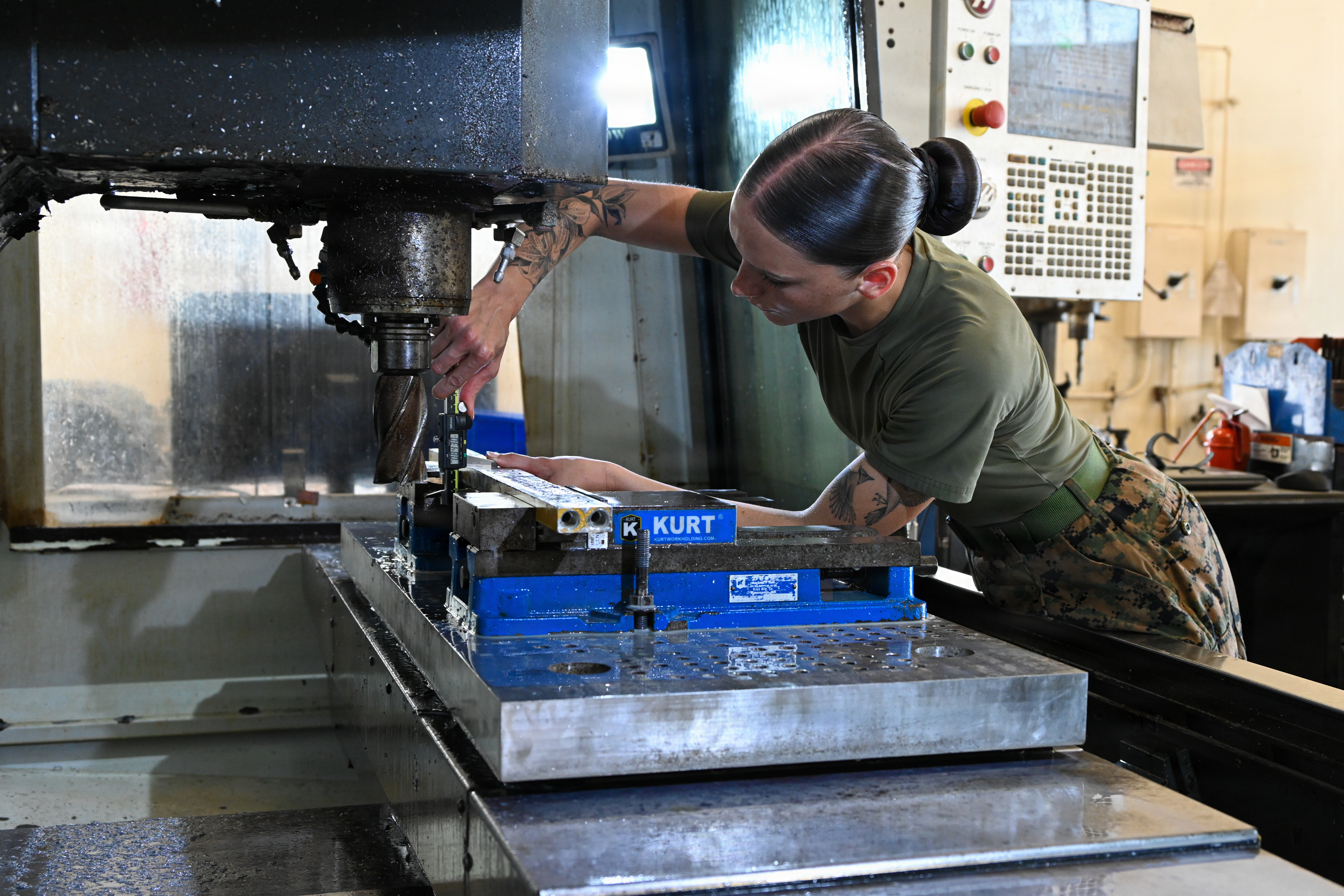 U.S. Marine Corps Lance Cpl. Madison Georgia, a machinist with Intermediate Repair Company, 3rd Maintenance Battalion, 3rd Marine Logistics Group, uses a computer numerical control machine during Valiant Shield 26 on Camp Kinser, Okinawa, Japan, June 22, 2026. Intermediate Repair Company participated in Resilient Advanced Manufacturing for Contested Environments, or RAMFORCE, an initiative hosted by the Office of the Under Secretary of Defense for Research and Engineering. The innovative event brought together military personnel, government laboratories, and private industry to evaluate how advanced
manufacturing technologies could enable expeditionary forces to repair, replace and even produce critical equipment at the point of need. (U.S. Marine Corps photo by Cpl. Rachel Mason)