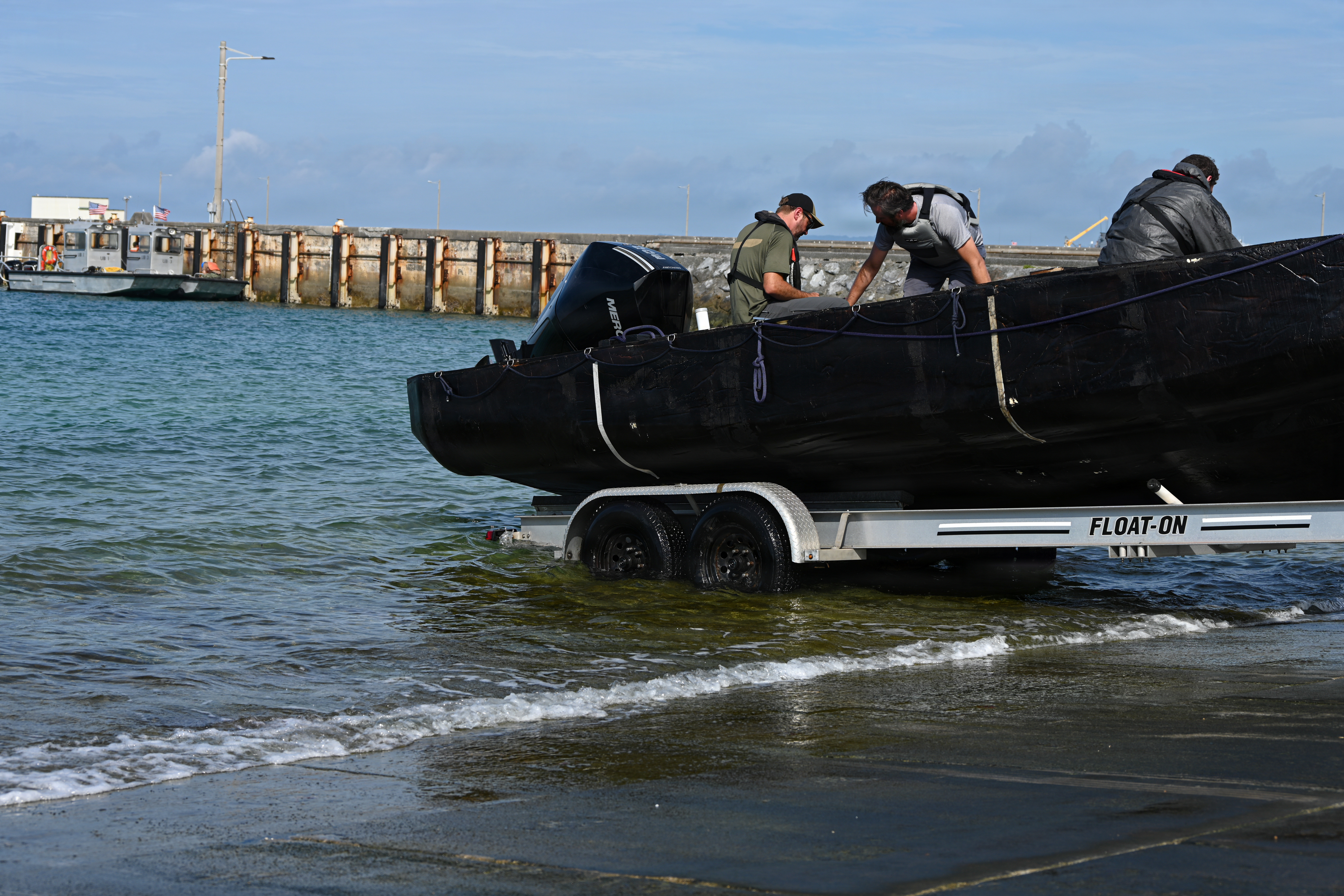 A Foam Raiding Craft is launched into the ocean during Valiant Shield 26 at White Beach, Okinawa, Japan, June 29, 2026. The foam craft was created in part by Marines with Intermediate Repair Company, 3rd Maintenance Battalion, 3rd Marine Logistics Group, as part of Resilient Advanced Manufacturing for Contested Environments, or RAMFORCE, an initiative hosted by the Office of the Under Secretary of Defense for Research and Engineering. The innovative event brought together military personnel, government laboratories, and private industry to evaluate how advanced manufacturing technologies could enable expeditionary forces to repair, replace and even produce critical equipment at the point of need. (U.S. Marine Corps photo by Cpl. Rachel Mason)
