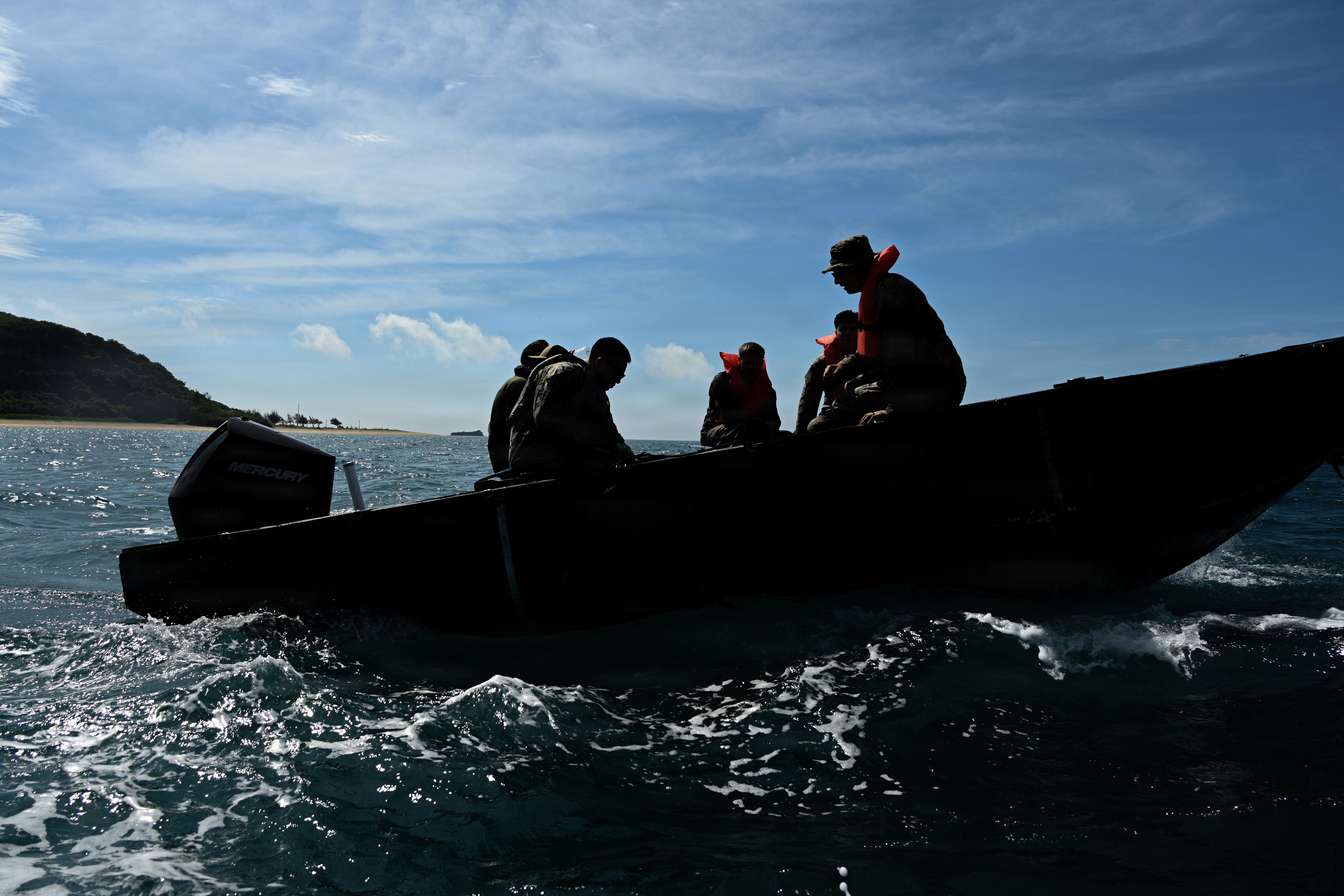 U.S. Marines with Intermediate Repair Company, 3rd Maintenance Battalion, 3rd Marine Logistics Group, and Department of Navy civilians from Naval Surface Warfare Center Carderock, ride in a remote-control Foam Raiding Craft during Valiant Shield 26 at White Beach, Okinawa, Japan, June 29, 2026. The foam craft was created in part by Marines with IRC as part of Resilient Advanced Manufacturing for Contested Environments, or RAMFORCE, an initiative hosted by the Office of the Under Secretary of Defense for Research and Engineering. The innovative event brought together military personnel, government laboratories, and private industry to evaluate how advanced manufacturing technologies could enable expeditionary forces to repair, replace and even produce critical equipment at the point of need. (U.S. Marine Corps photo by Cpl. Rachel Mason)
