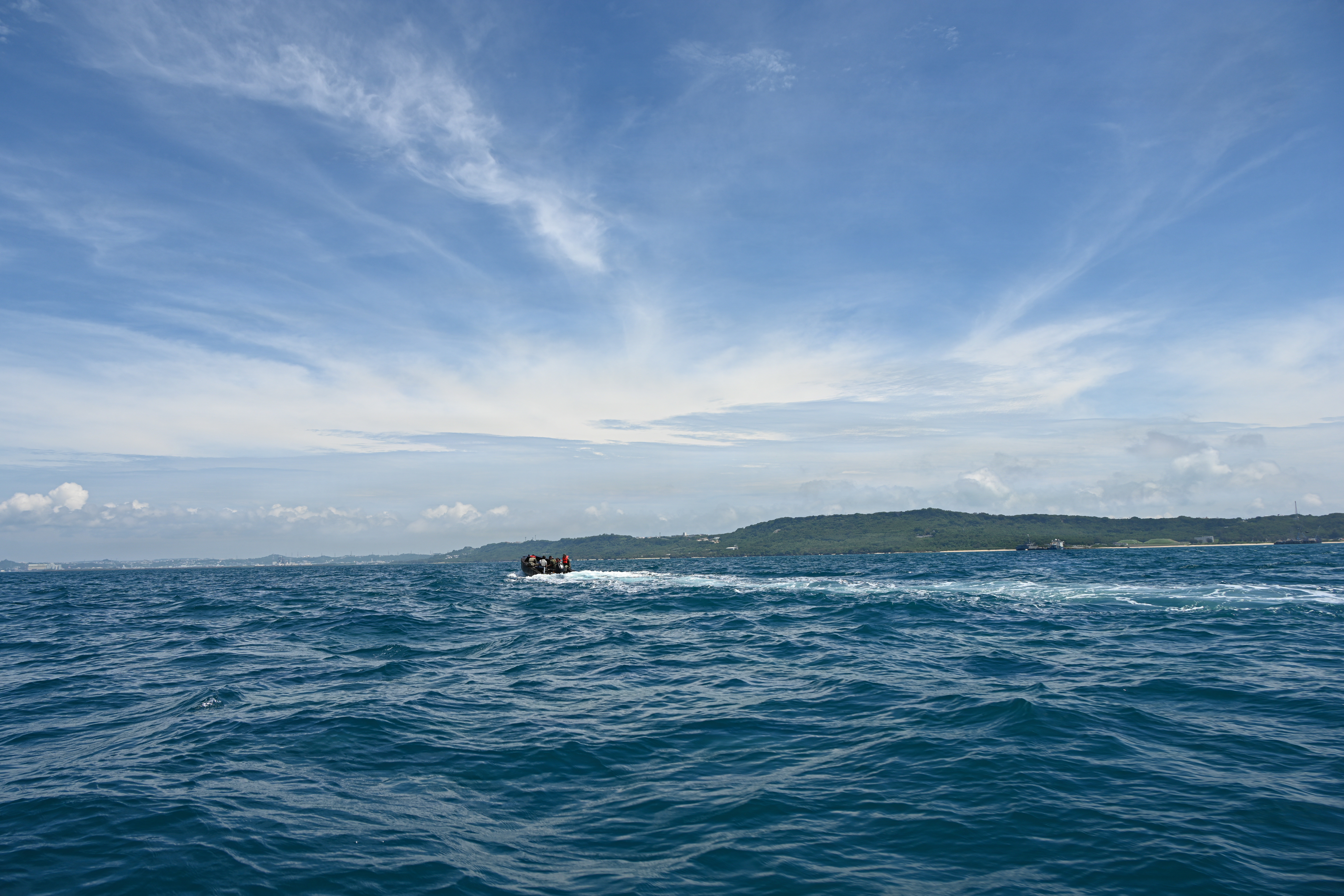 U.S. Marines with Intermediate Repair Company, 3rd Maintenance Battalion, 3rd Marine Logistics Group, and Department of Navy civilians from Naval Surface Warfare Center Carderock, ride in a remote-control Foam Raiding Craft during Valiant Shield 26 at White Beach, Okinawa, Japan, June 29, 2026. The foam craft was created in part by Marines with IRC as part of Resilient Advanced Manufacturing for Contested Environments, or RAMFORCE, an initiative hosted by the Office of the Under Secretary of Defense for Research and Engineering. The innovative event brought together military personnel, government laboratories, and private industry to evaluate how advanced manufacturing technologies could enable expeditionary forces to repair, replace and even produce critical equipment at the point of need. (U.S. Marine Corps photo by Cpl. Rachel Mason)