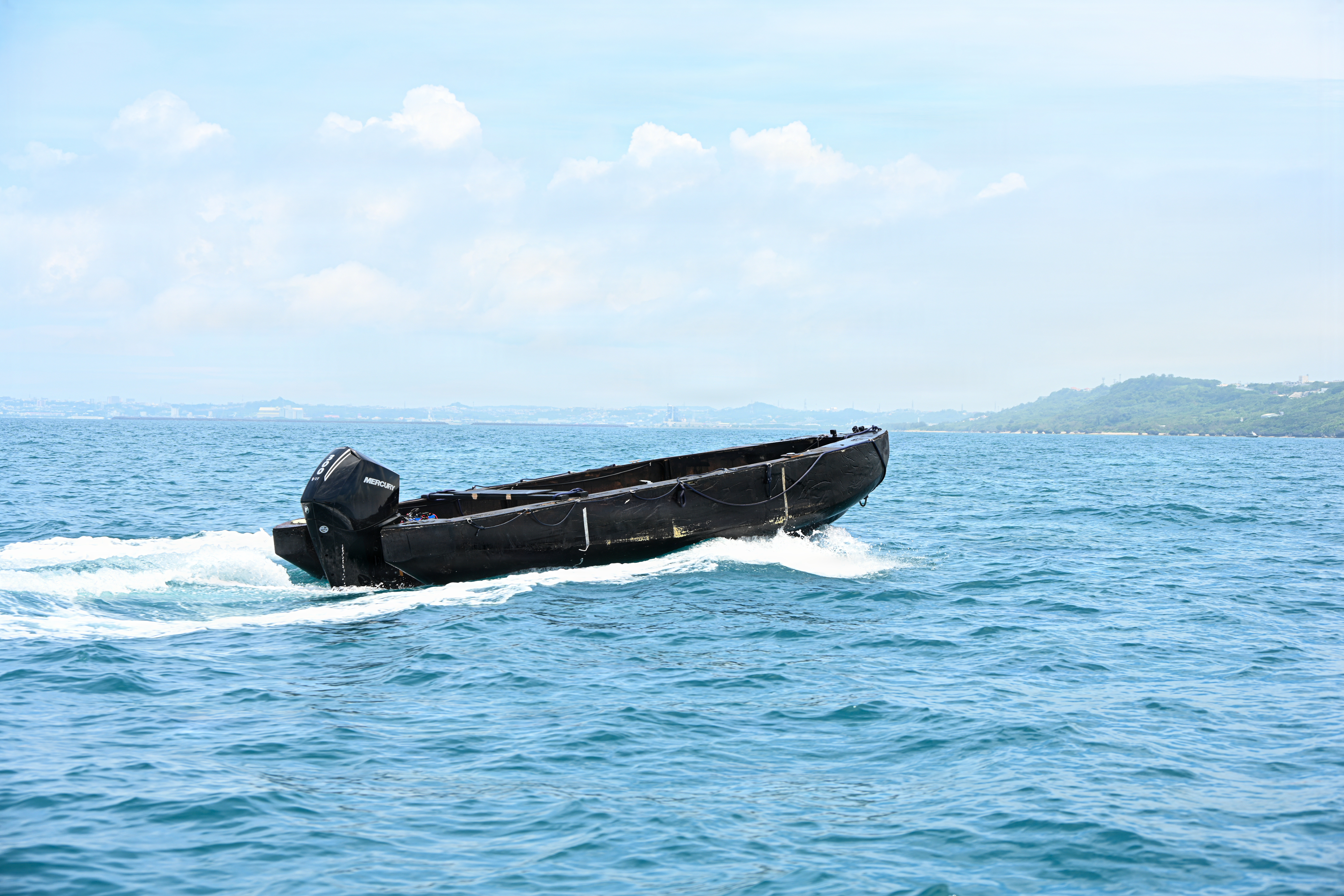 An unmanned Foam Raiding Craft operates through remote control capabilities during Valiant Shield 26 at White Beach, Okinawa, Japan, June 29, 2026. The foam craft was created in part by Marines with Intermediate Repair Company, 3rd Maintenance Battalion, 3rd Marine Logistics Group, as part of Resilient Advanced Manufacturing for Contested Environments, or RAMFORCE, an initiative hosted by the Office of the Under Secretary of Defense for Research and Engineering. The innovative event brought together military personnel, government laboratories, and private industry to evaluate how advanced manufacturing technologies could enable expeditionary forces to repair, replace and even produce critical equipment at the point of need. (U.S. Marine Corps photo by Cpl. Rachel Mason)