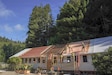 U.S. Airmen assigned to the 201st Rapid Engineer Deployable Heavy Operational Repair Squadron Engineers, 193rd Special Operations Wing and 111th Attack Wing, Pennsylvania Air National Guard, work on roof structures during an Innovative Readiness Training project at Redwood National and State Parks near Orick, California, July 17, 2026. The work advanced the conversion of a former fish hatchery into a learning center while giving the Airmen hands-on construction training. (U.S. Air National Guard photo by Airman 1st Class Austin Stern)