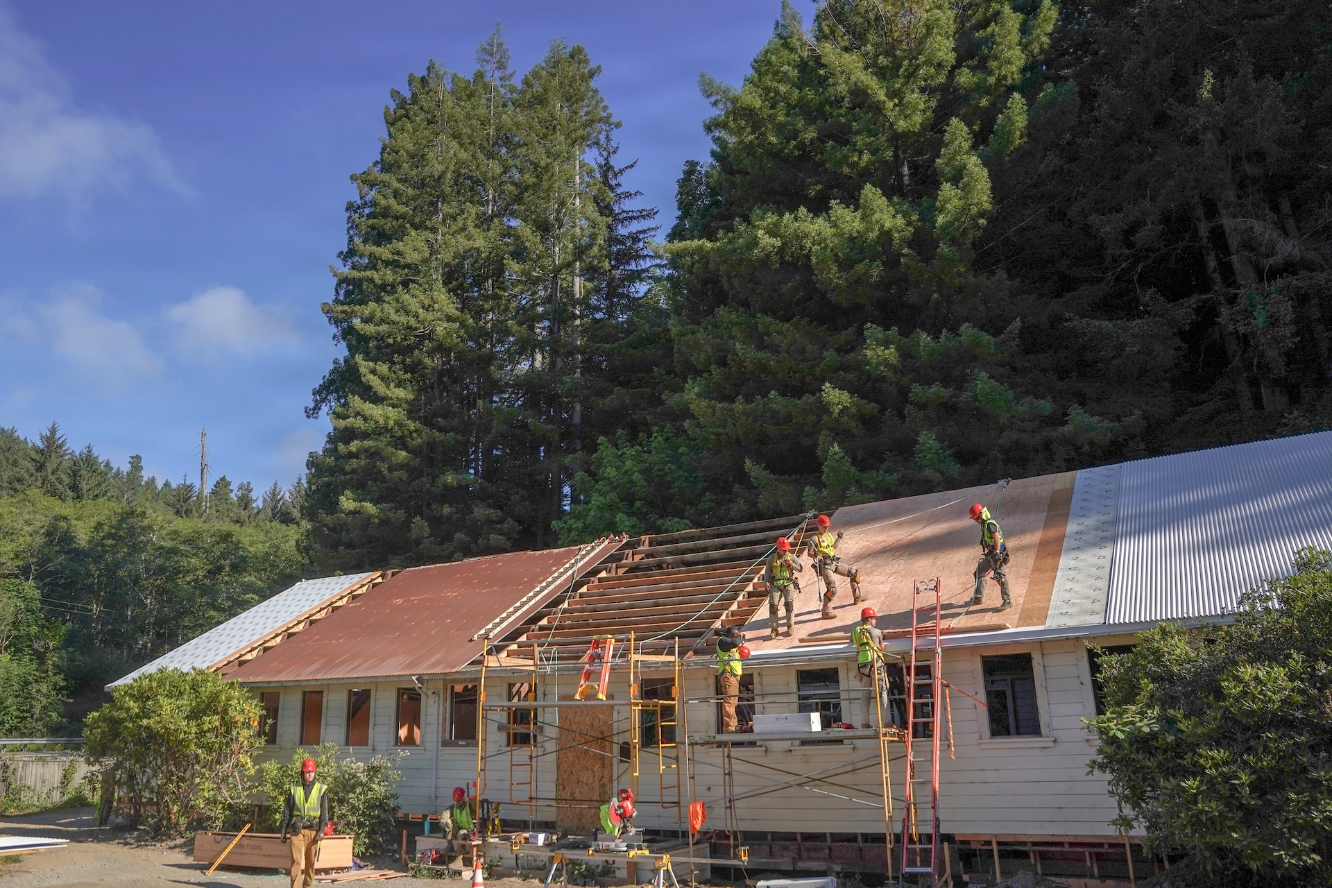 U.S. Airmen assigned to the 201st Rapid Engineer Deployable Heavy Operational Repair Squadron Engineers, 193rd Special Operations Wing and 111th Attack Wing, Pennsylvania Air National Guard, work on roof structures during an Innovative Readiness Training project at Redwood National and State Parks near Orick, California, July 17, 2026. The work advanced the conversion of a former fish hatchery into a learning center while giving the Airmen hands-on construction training. (U.S. Air National Guard photo by Airman 1st Class Austin Stern)