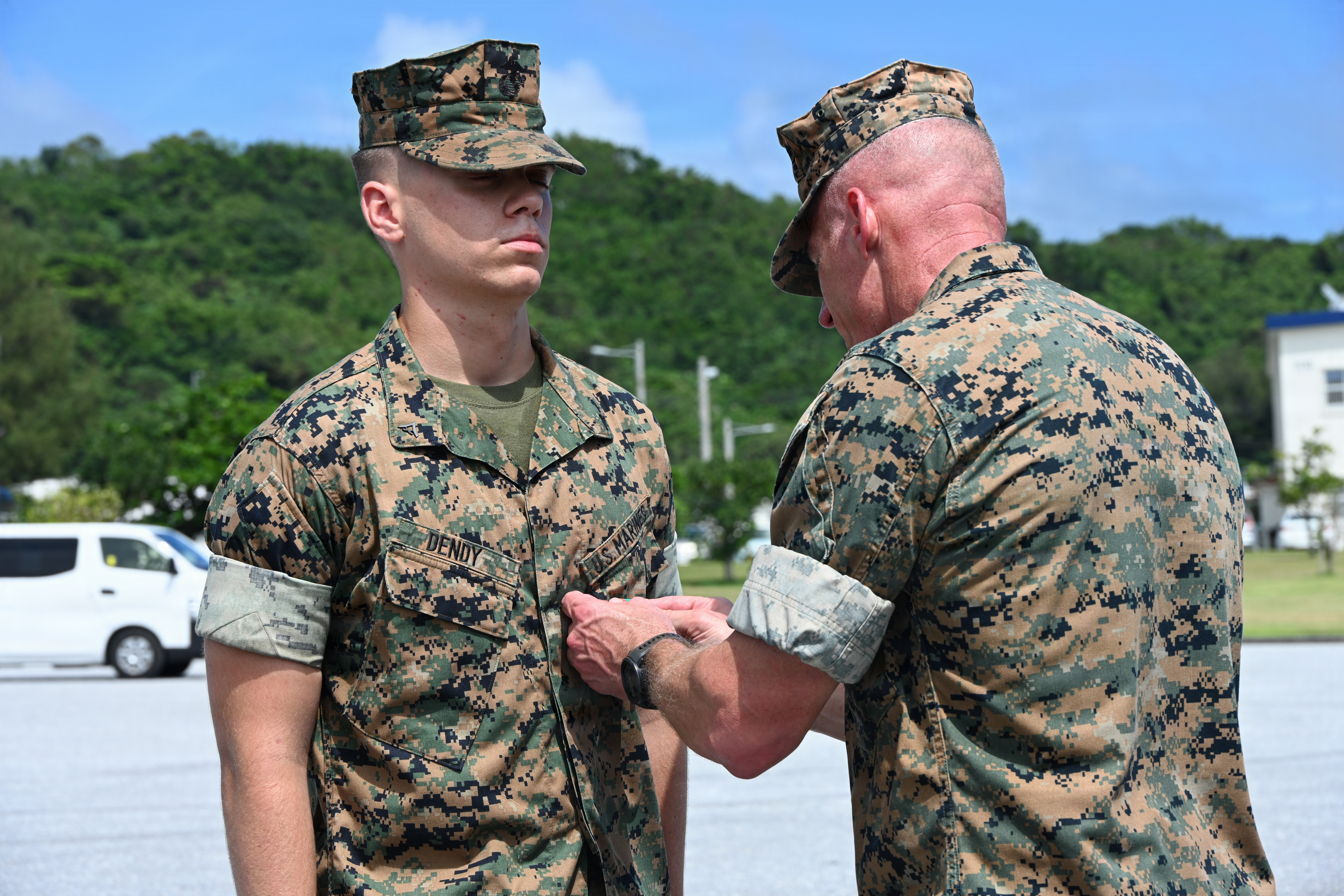 U.S. Marine Corps Lance Cpl. Jesse Dendy, left an amphibious combat vehicle technician with Intermediate Repair Company, 3rd Maintenance Battalion, 3rd Marine Logistics Group, receives a Navy and Marine Corps Achievement Medal from Lt. Gen. Roger Turner, Commanding General of III Marine Expeditionary Force, during Valiant Shield 26 at White Beach, Okinawa, Japan, June 29, 2026. Intermediate Repair Company participated in Resilient Advanced Manufacturing for Contested Environments, or RAMFORCE, an initiative hosted by the Office of the Under Secretary of Defense for Research and Engineering. The innovative event brought together military personnel, government laboratories and private industry to evaluate how
advanced manufacturing technologies could enable expeditionary forces to repair, replace and even produce critical equipment at the point of need. (U.S. Marine Corps photo by Cpl. Rachel Mason)