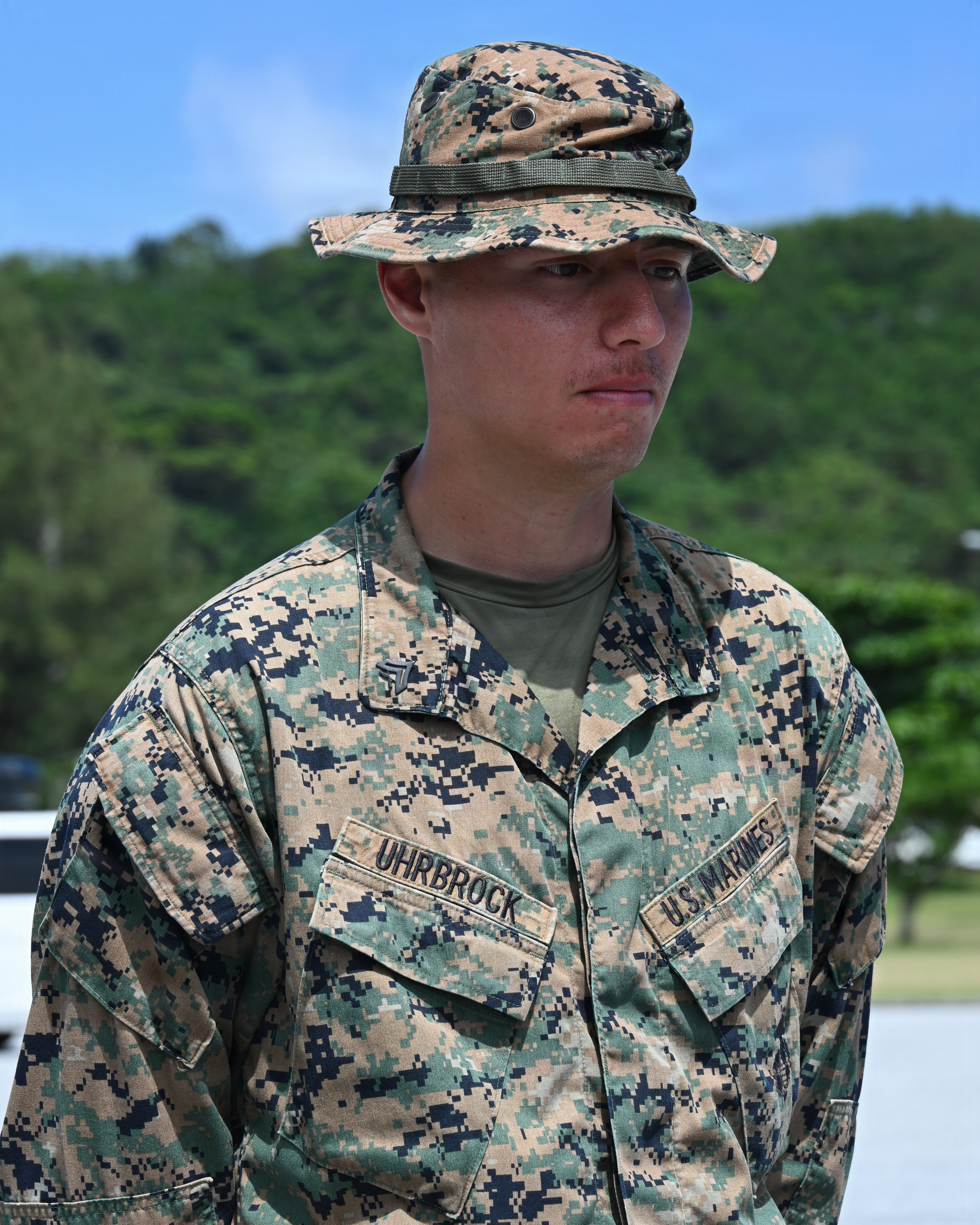 U.S. Marine Corps Cpl. Noah Uhrbrock, a calibration technician with Intermediate Repair Company, 3rd Maintenance Battalion, 3rd Marine Logistics Group, stands at parade rest before receiving a Navy and Marine Corps Achievement Medal during Valiant Shield 26 at White Beach, Okinawa, Japan, June 29, 2026. Intermediate Repair Company participated in Resilient Advanced Manufacturing for Contested Environments, or RAMFORCE, an initiative hosted by the Office of the Under Secretary of Defense for Research and Engineering. The innovative event brought together military personnel, government laboratories and private industry to evaluate how advanced manufacturing technologies could enable expeditionary forces to repair, replace and even produce critical equipment at the point of need. (U.S. Marine Corps photo by Cpl. Rachel Mason)