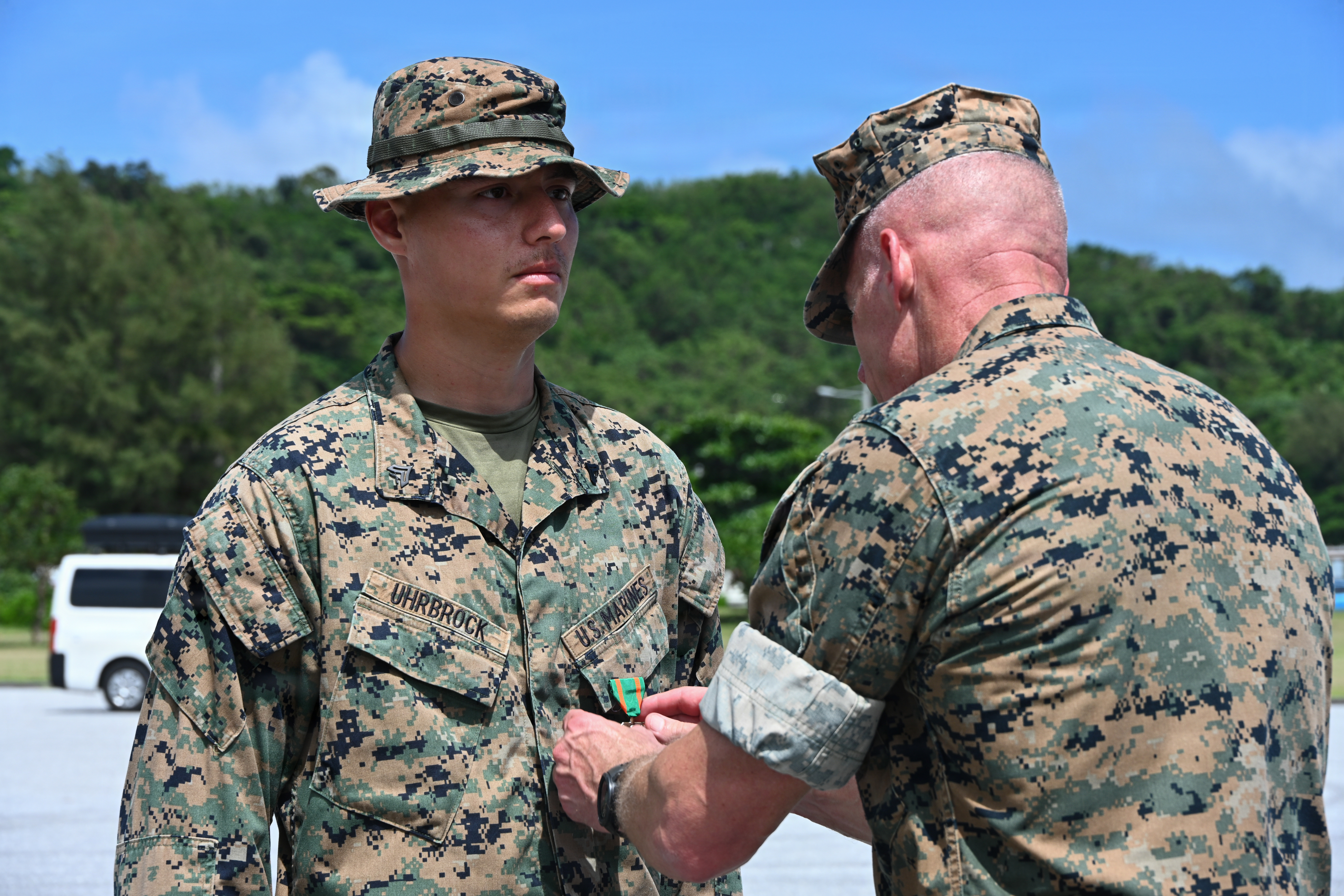 U.S. Marine Corps Cpl. Noah Uhrbrock, left, a calibration technician with Intermediate Repair Company, 3rd Maintenance Battalion, 3rd Marine Logistics Group, receives a Navy and Marine Corps Achievement Medal from Lt. Gen. Roger Turner, Commanding General of III Marine Expeditionary Force, during Valiant Shield 26 at White Beach, Okinawa, Japan, June 29, 2026.
Intermediate Repair Company participated in Resilient Advanced Manufacturing for Contested Environments, or RAMFORCE, an initiative hosted by the Office of the Under Secretary of Defense for Research and Engineering. The innovative event brought together military personnel, government laboratories and private industry to evaluate how advanced manufacturing technologies could enable expeditionary forces to repair, replace and even produce critical equipment at the point of need. (U.S. Marine Corps photo by Cpl. Rachel Mason)
