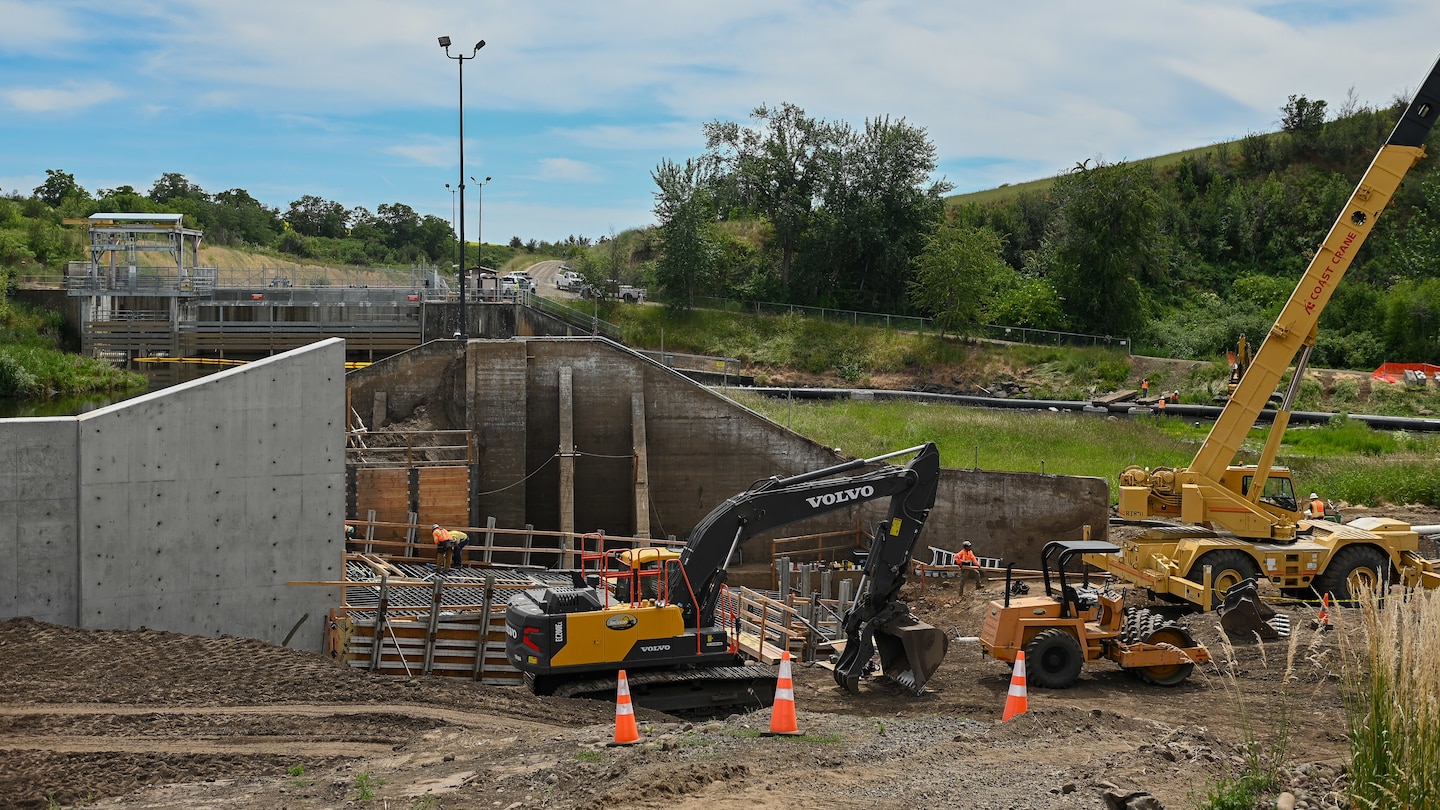 Newly constructed concrete retaining walls at the Mill Creek Fish Ladder Project, a project designed to improve fish passage and manage water flows.