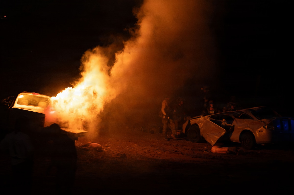 U.S. Air Force Pararescuemen assigned to the 38th Rescue Squadron work together to find isolated personnel in the darkness during Operation Iron Covenant, a training exercise near Benson, Arizona, July 22, 2026. Operation Iron Covenant also provided an opportunity for leaders to evaluate tactics, techniques and procedures while identifying areas for continued improvement before deployment. (U.S. Air Force photo by Airman Najzee Kuzu)